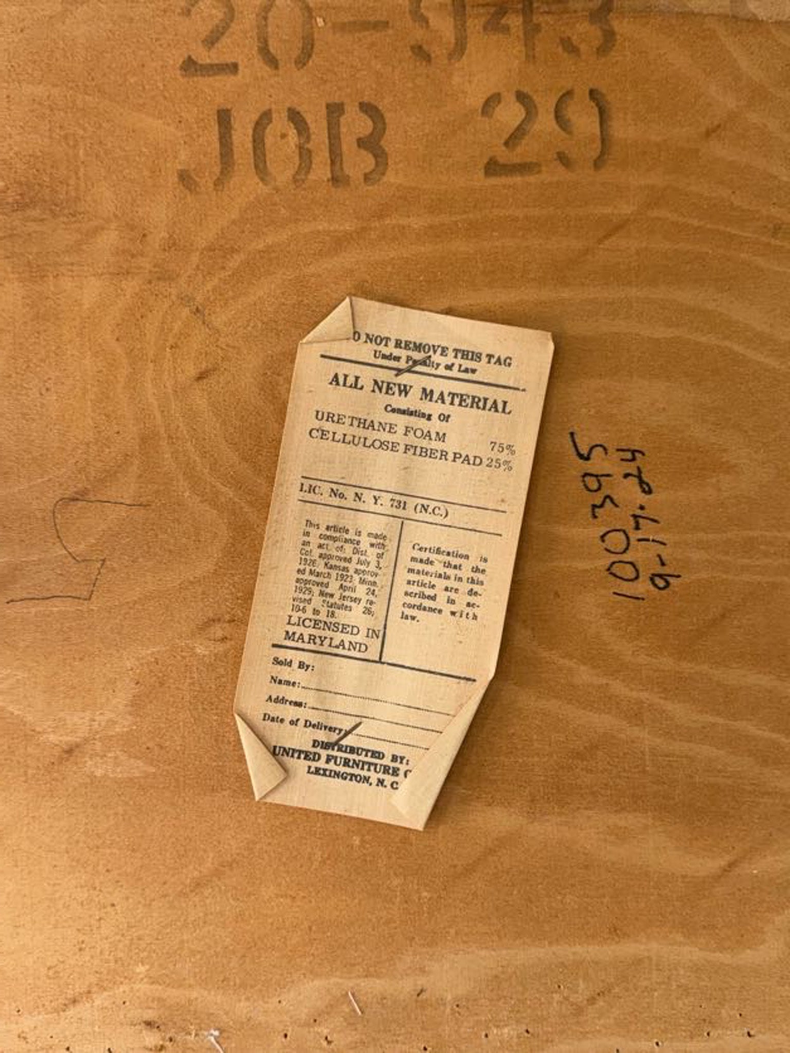 Vintage label on a wooden surface with embossed text