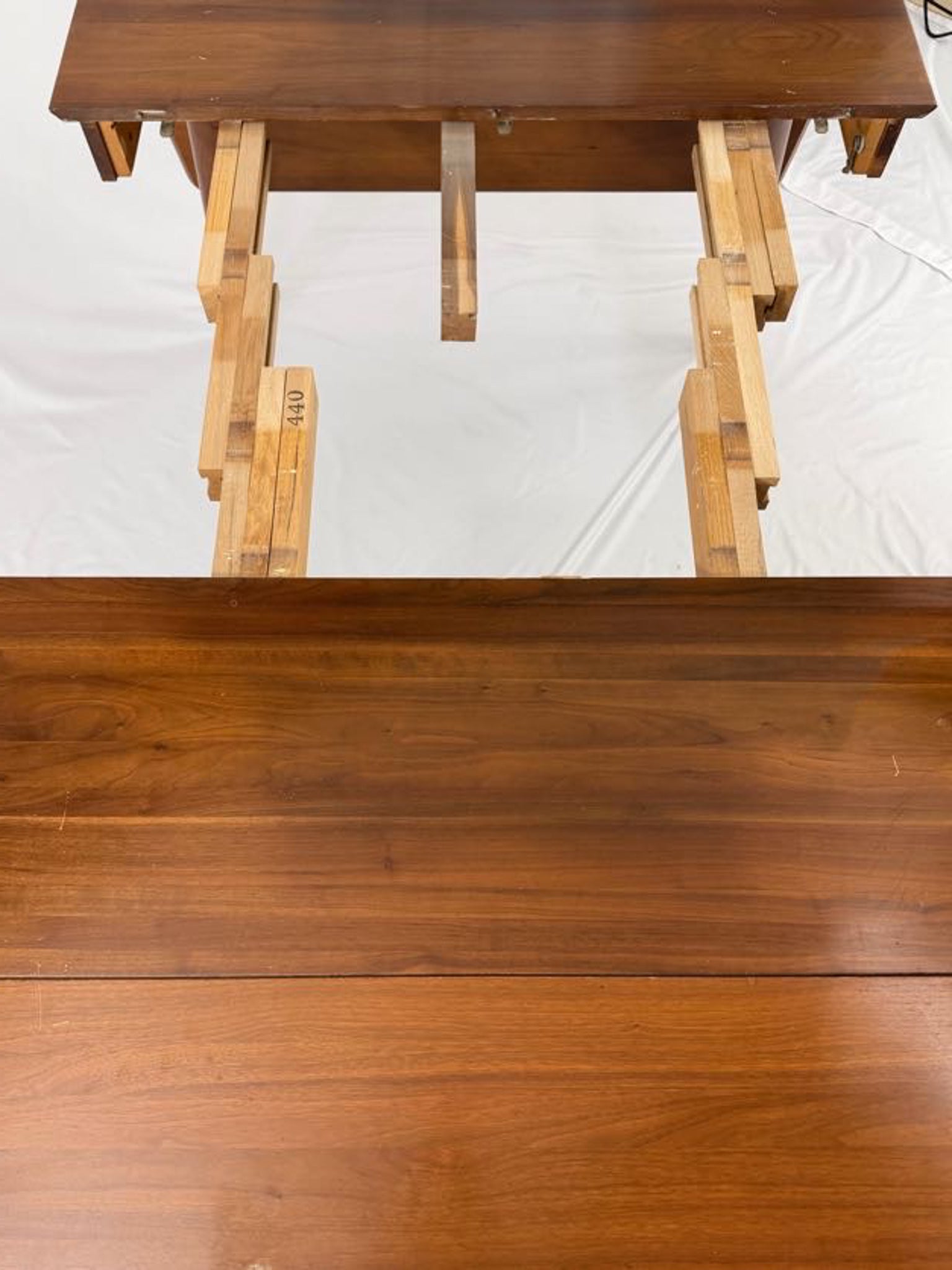 Wooden dining table on a white background