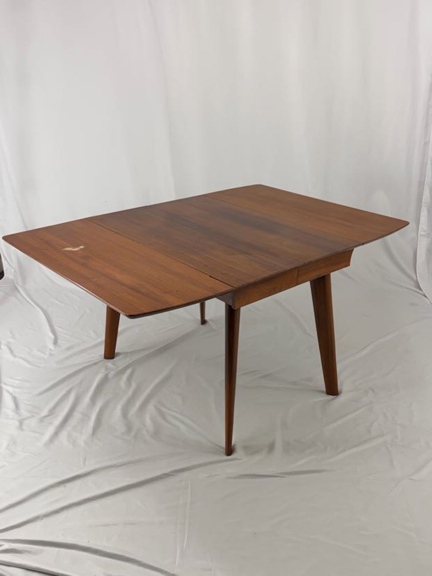 Wooden dining table on a white background
