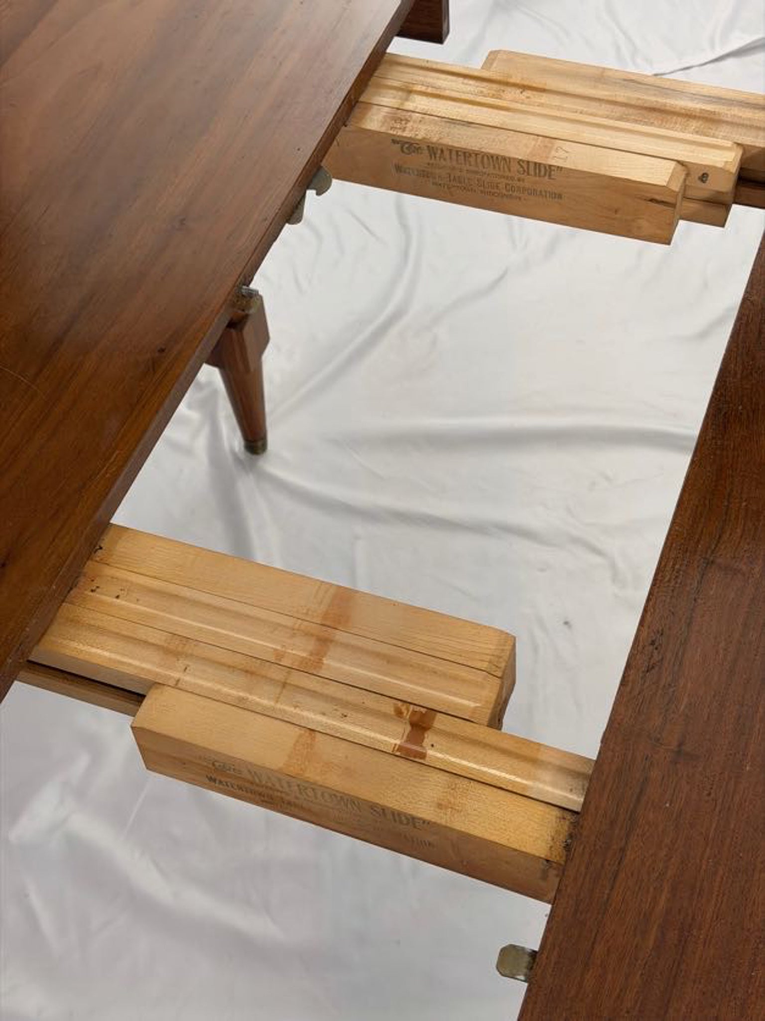 Wooden dining table on a white background