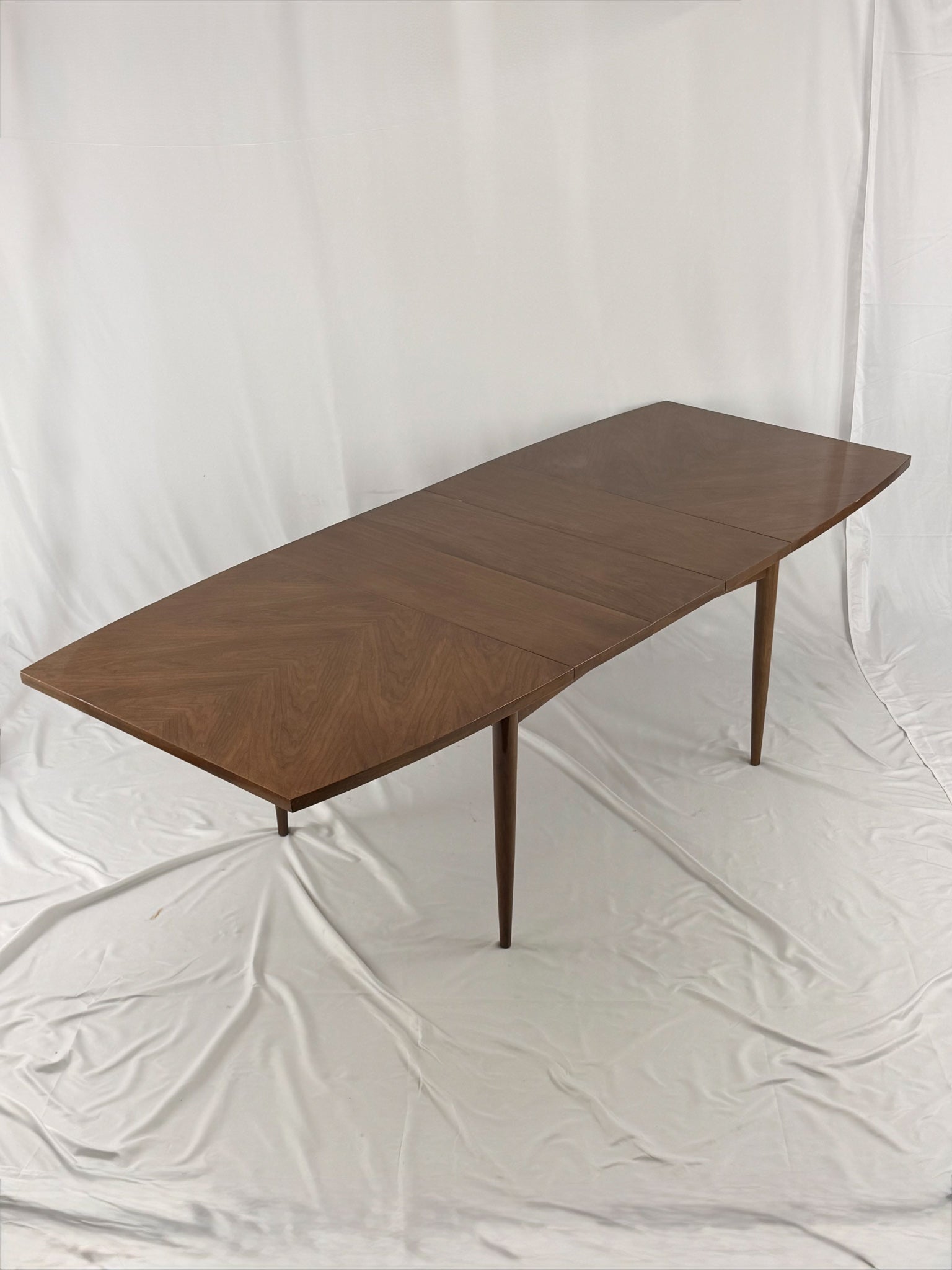 Wooden dining table on a white background