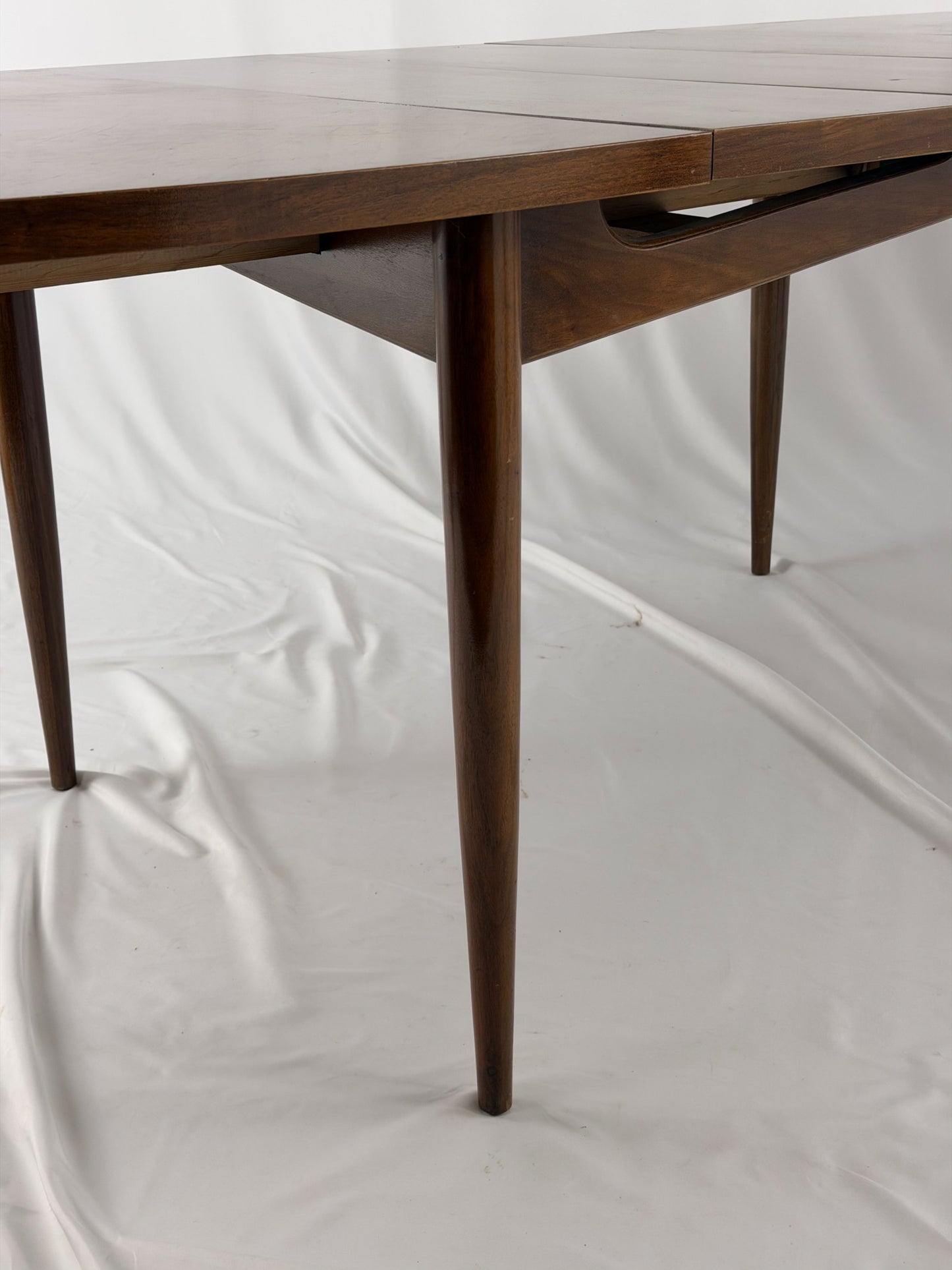 Wooden dining table with a white background