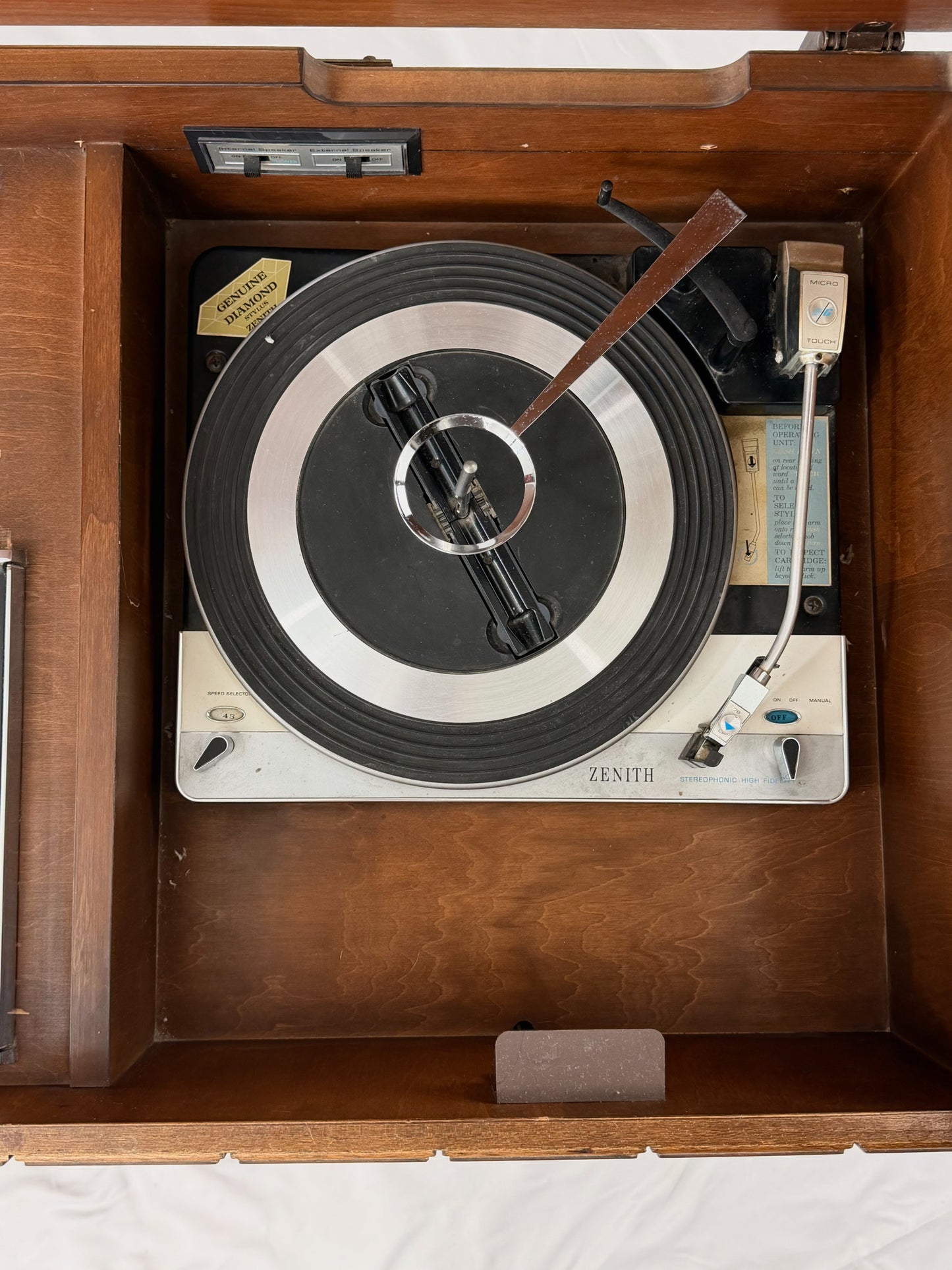 Vintage Zenith record player inside a wooden cabinet