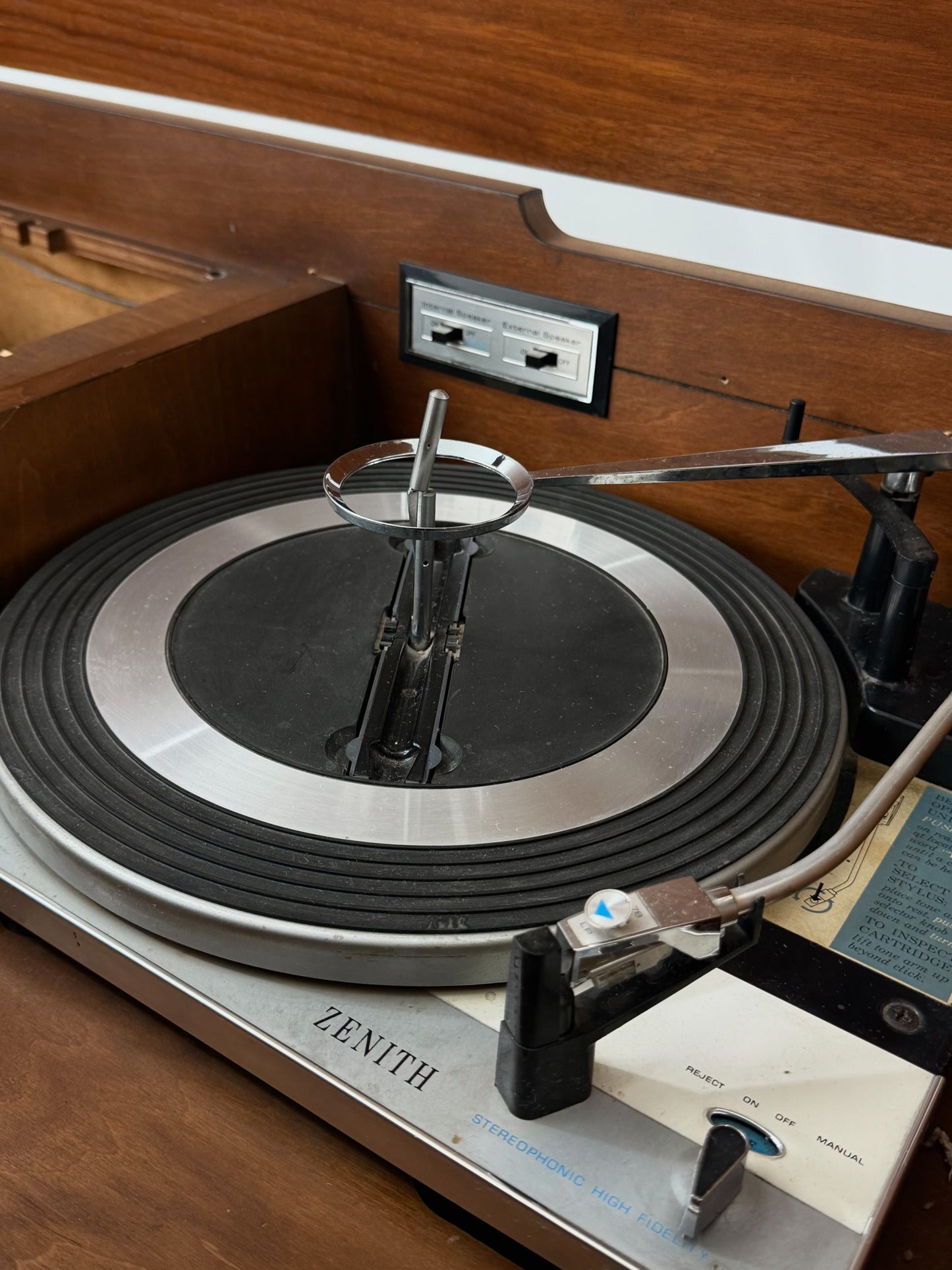 Vintage Zenith turntable with needle on a wooden surface