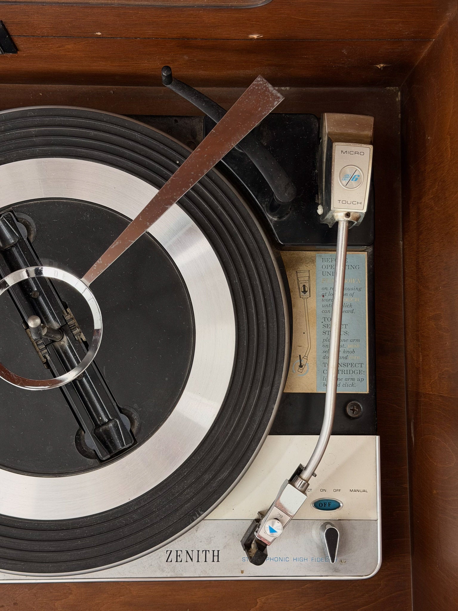Vintage Zenith reel-to-reel tape recorder with needle and head assembly.