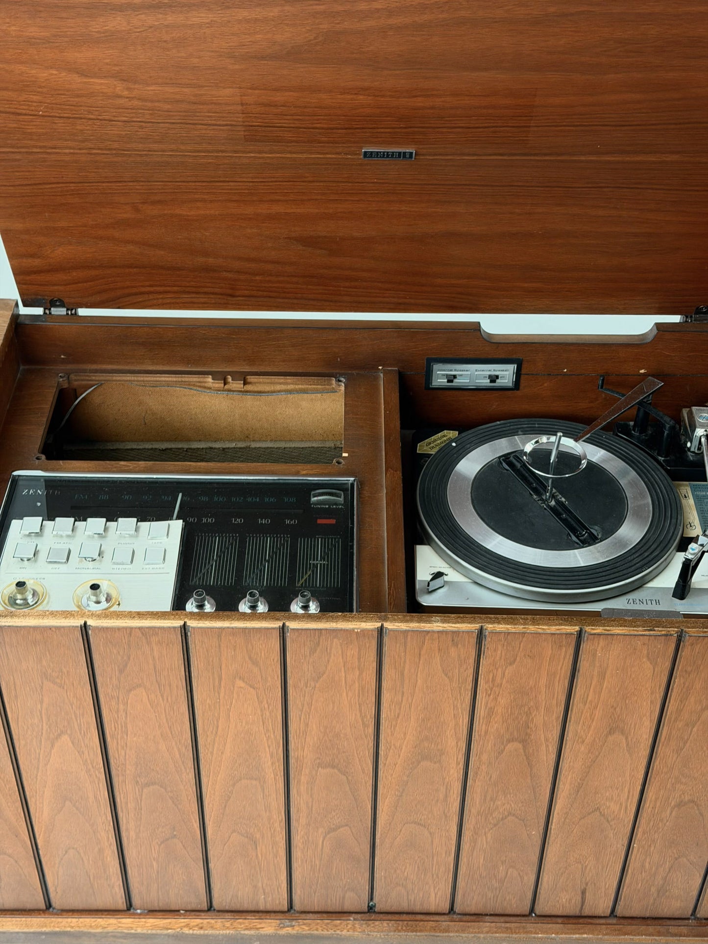 Wooden record player with turntable and radio inside
