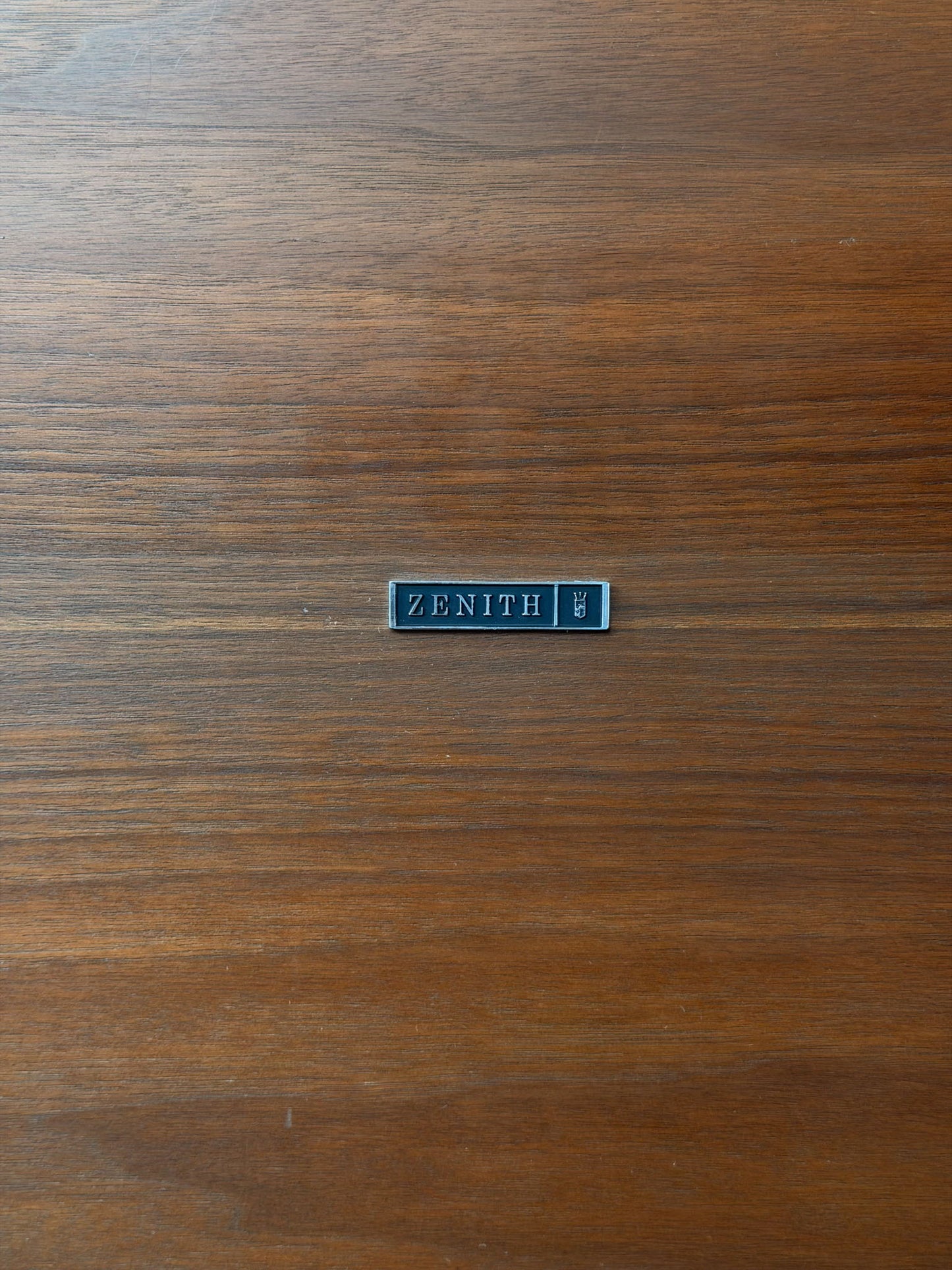 Zenith logo on a wooden surface