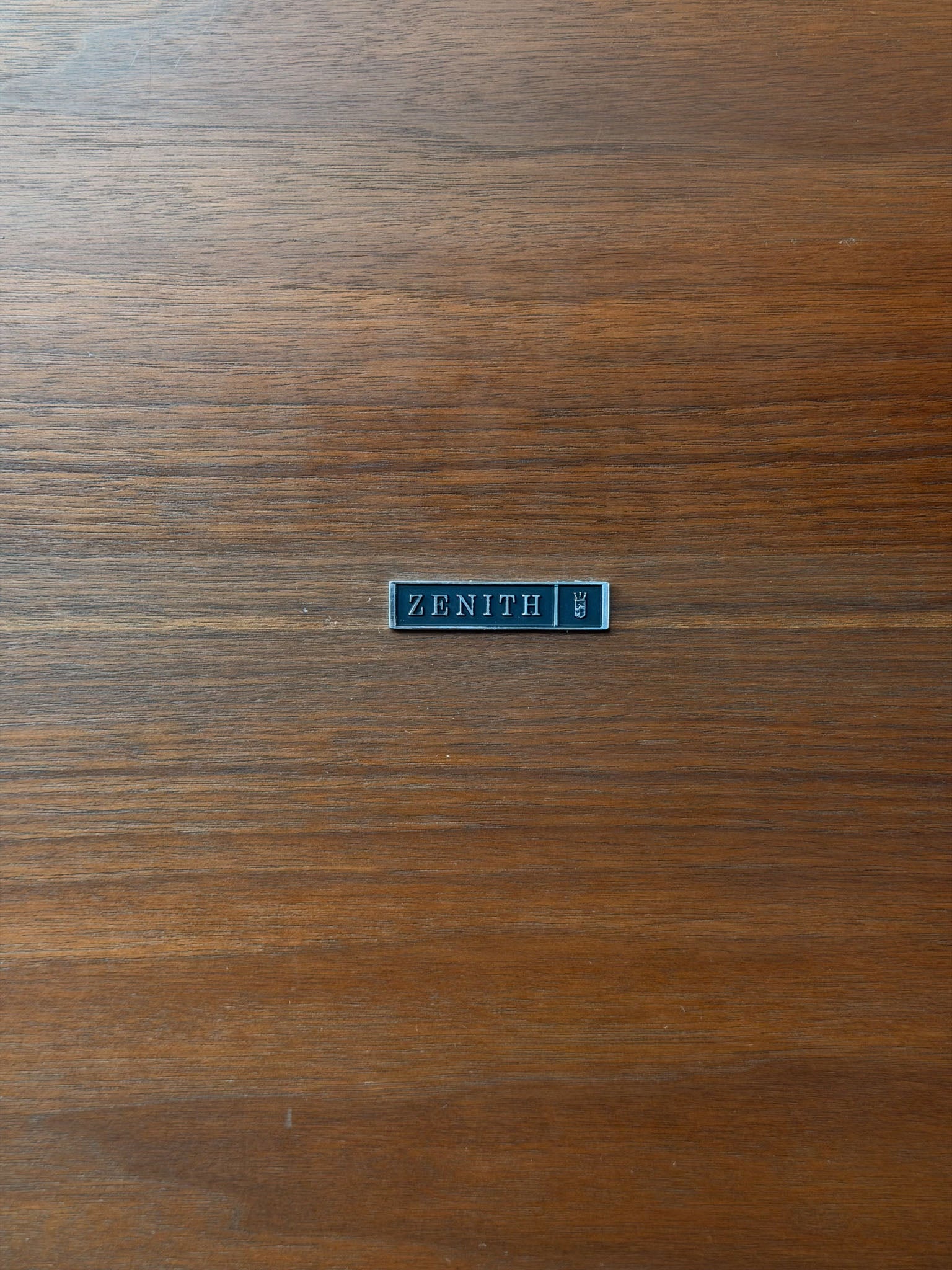 Zenith logo on a wooden surface