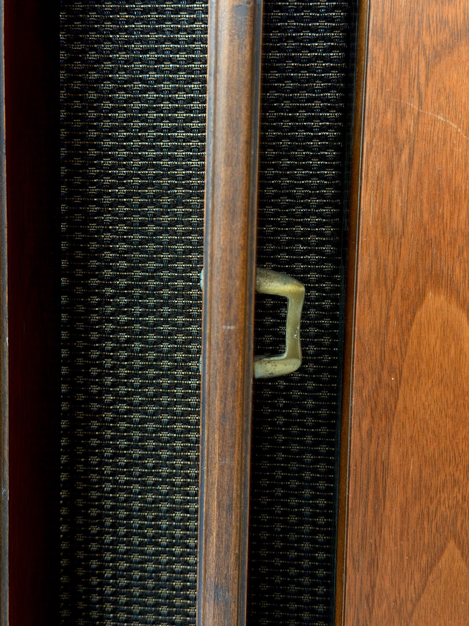 Vintage record player with a turntable and control panel on a wooden surface.