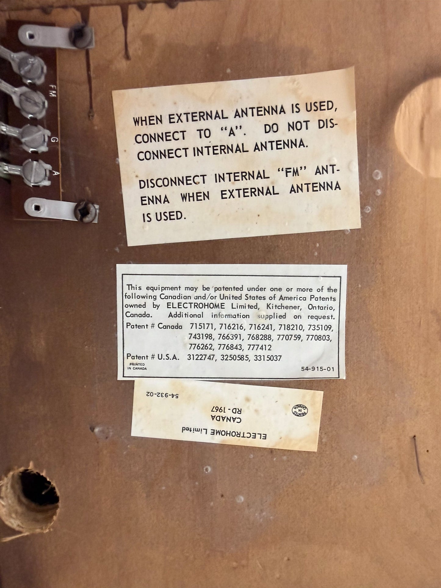 Vintage electronic equipment with labels and text on a brown background