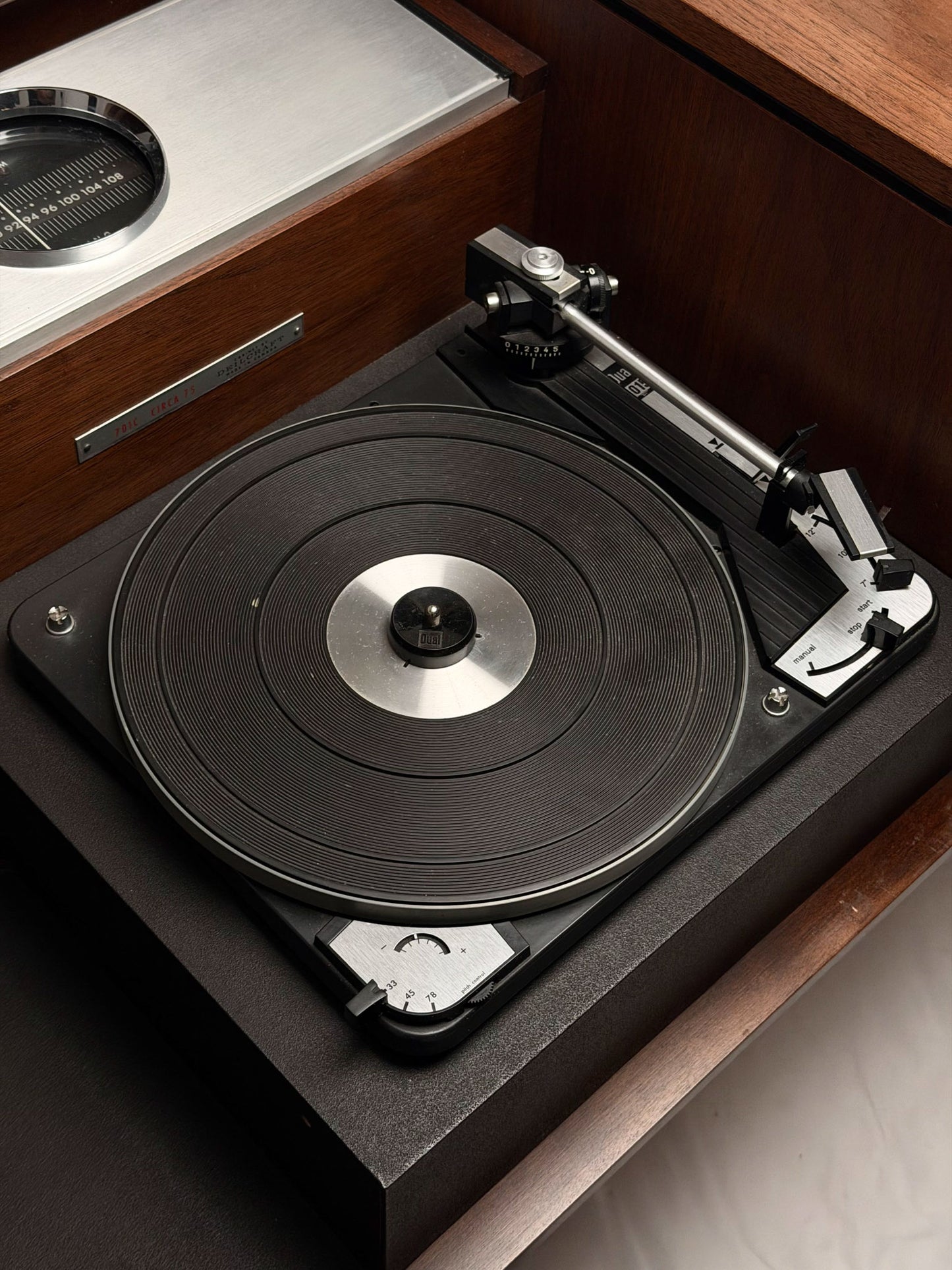 Turntable on a wooden surface with a close-up view