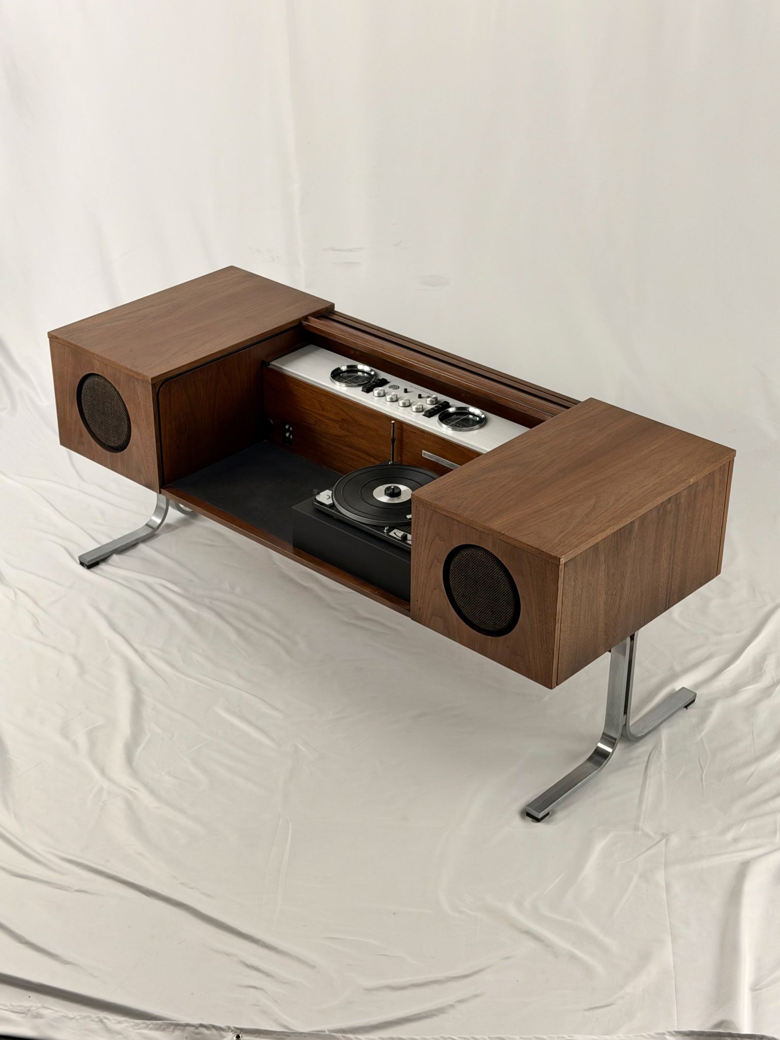 Electrohome vintage wooden stereo console with speakers on a white background