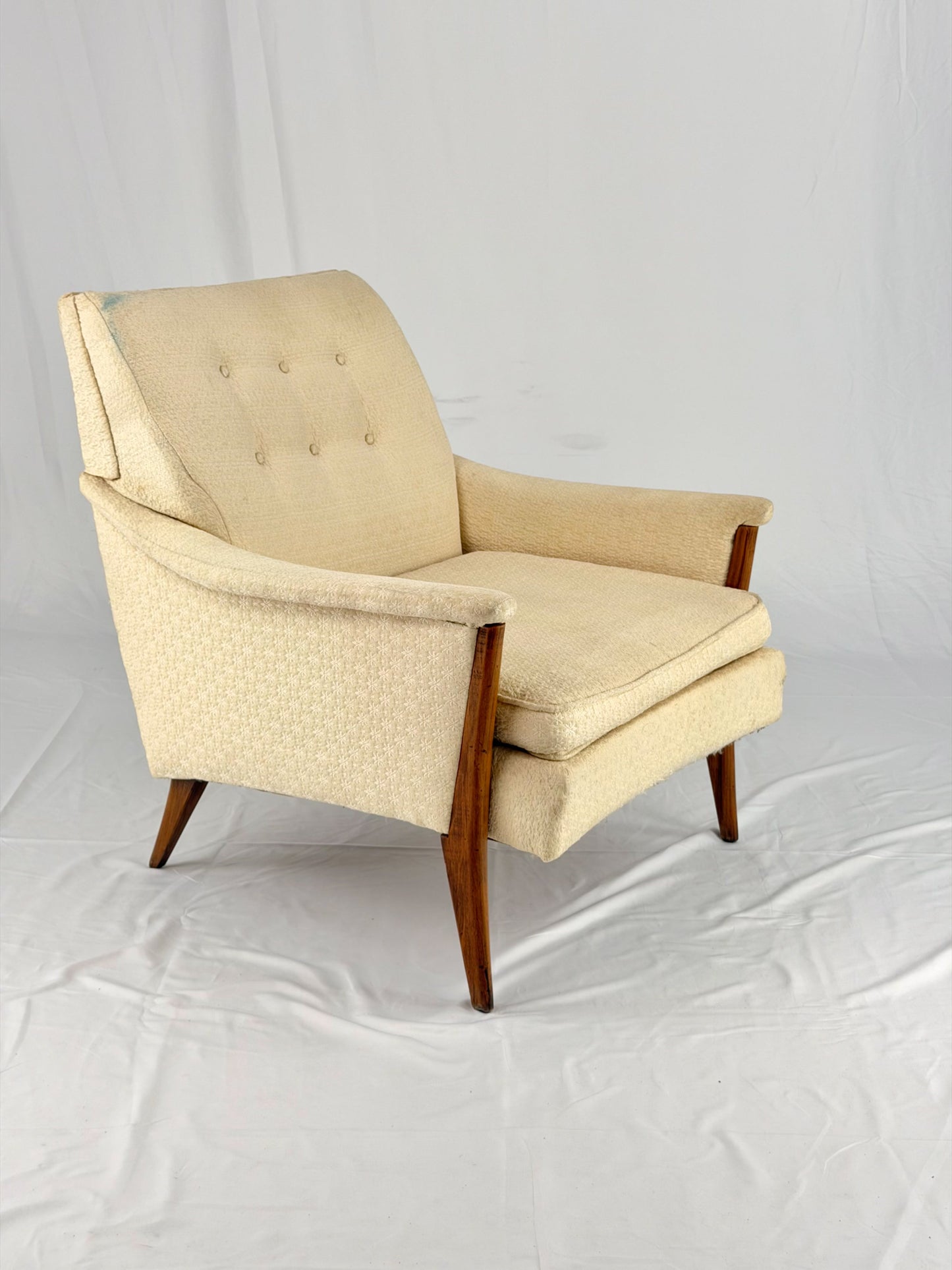 Beige armchair on a white background