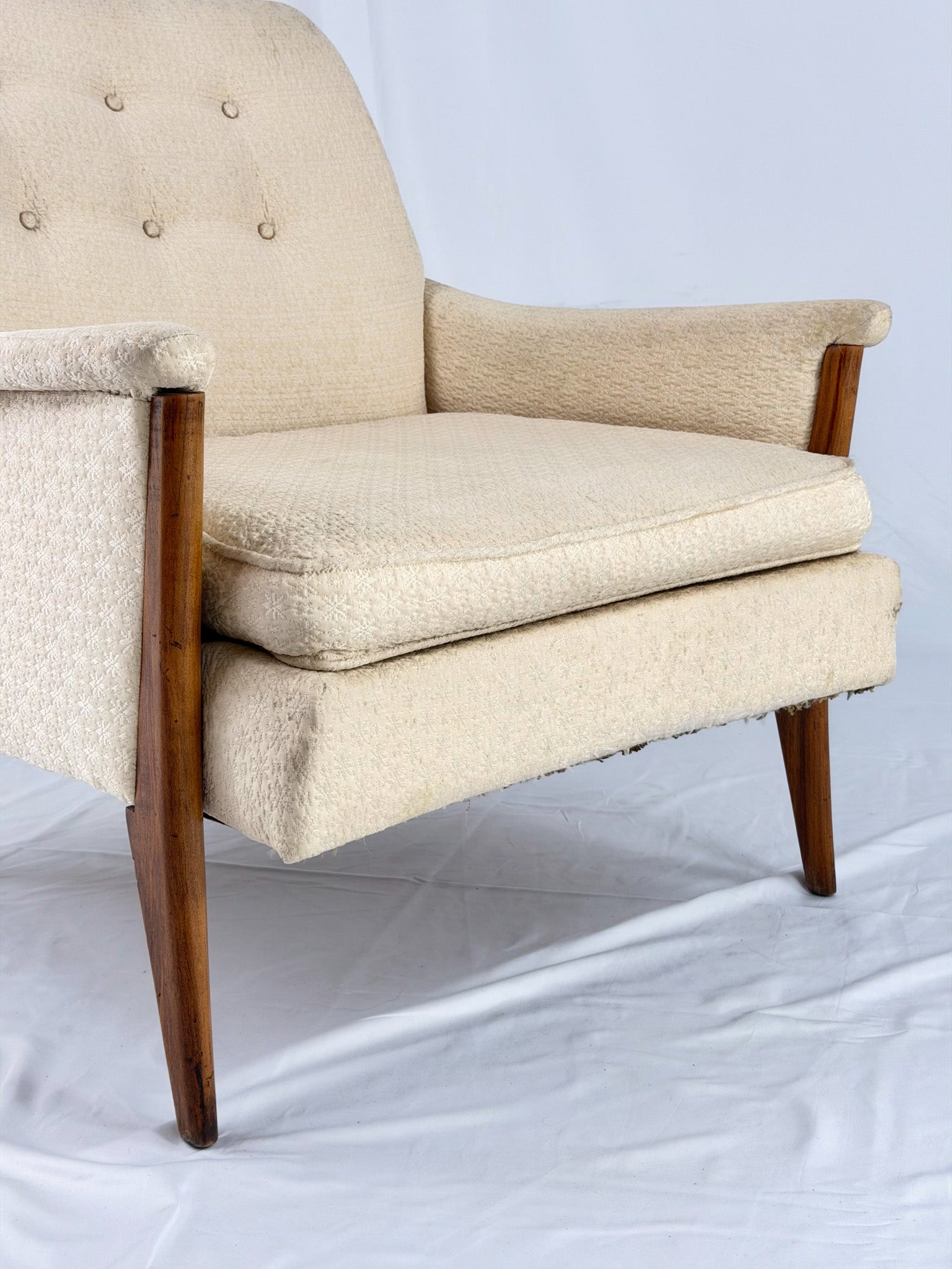 Beige armchair on a white background