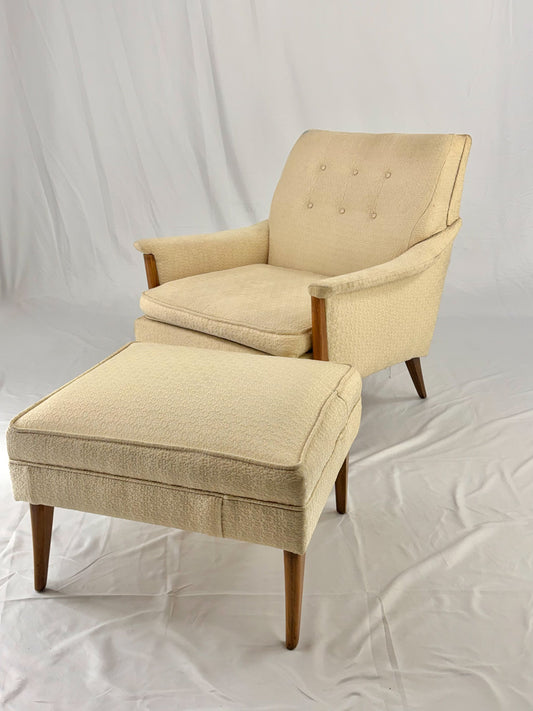Beige armchair with matching ottoman on a white background