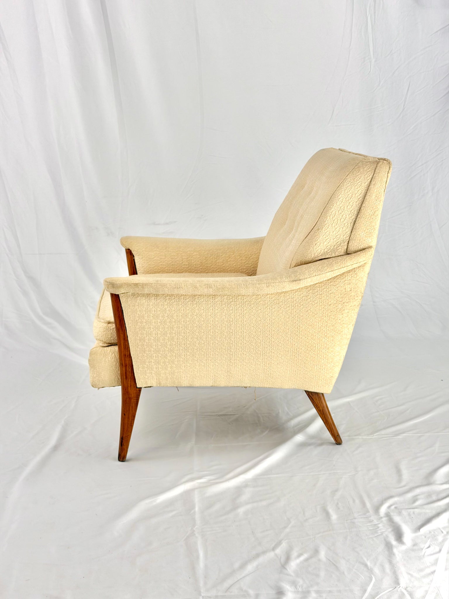 Beige armchair on a white background