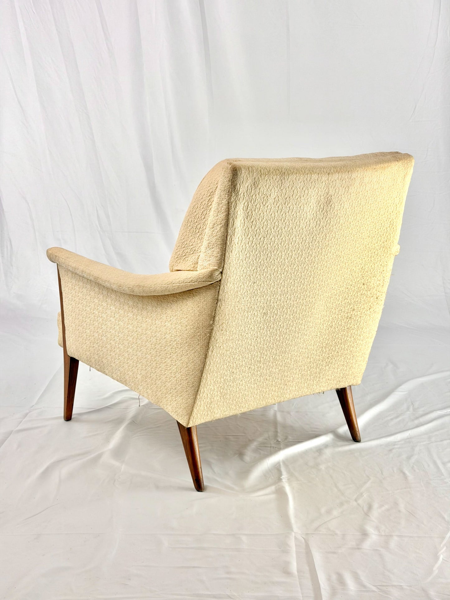 Beige armchair on a white background