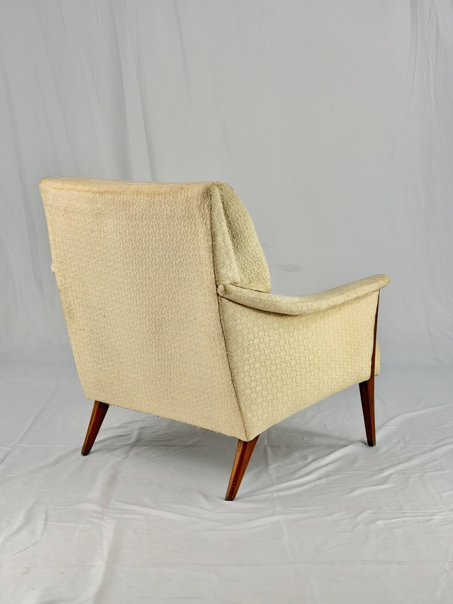 Beige armchair on a white background