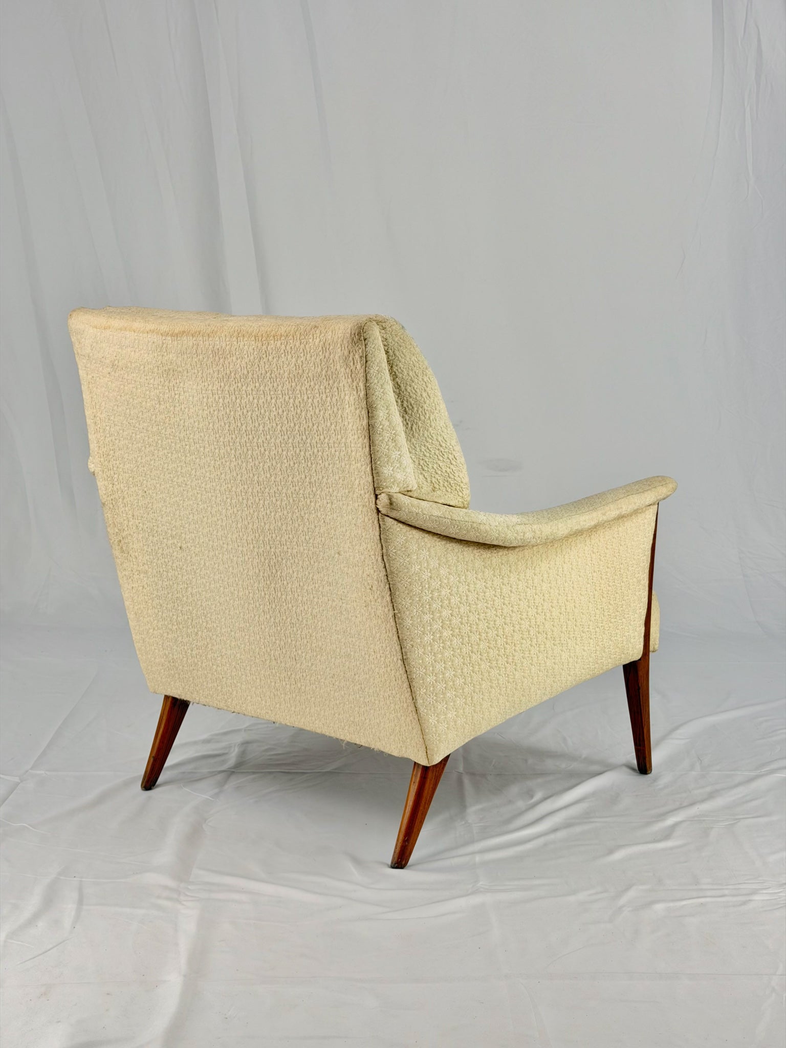 Beige armchair on a white background