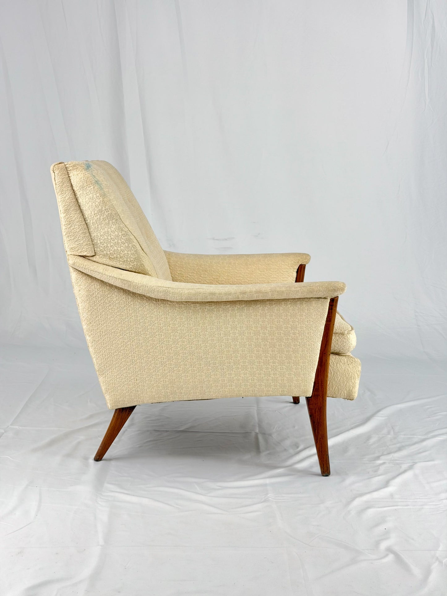 Beige armchair on a white background
