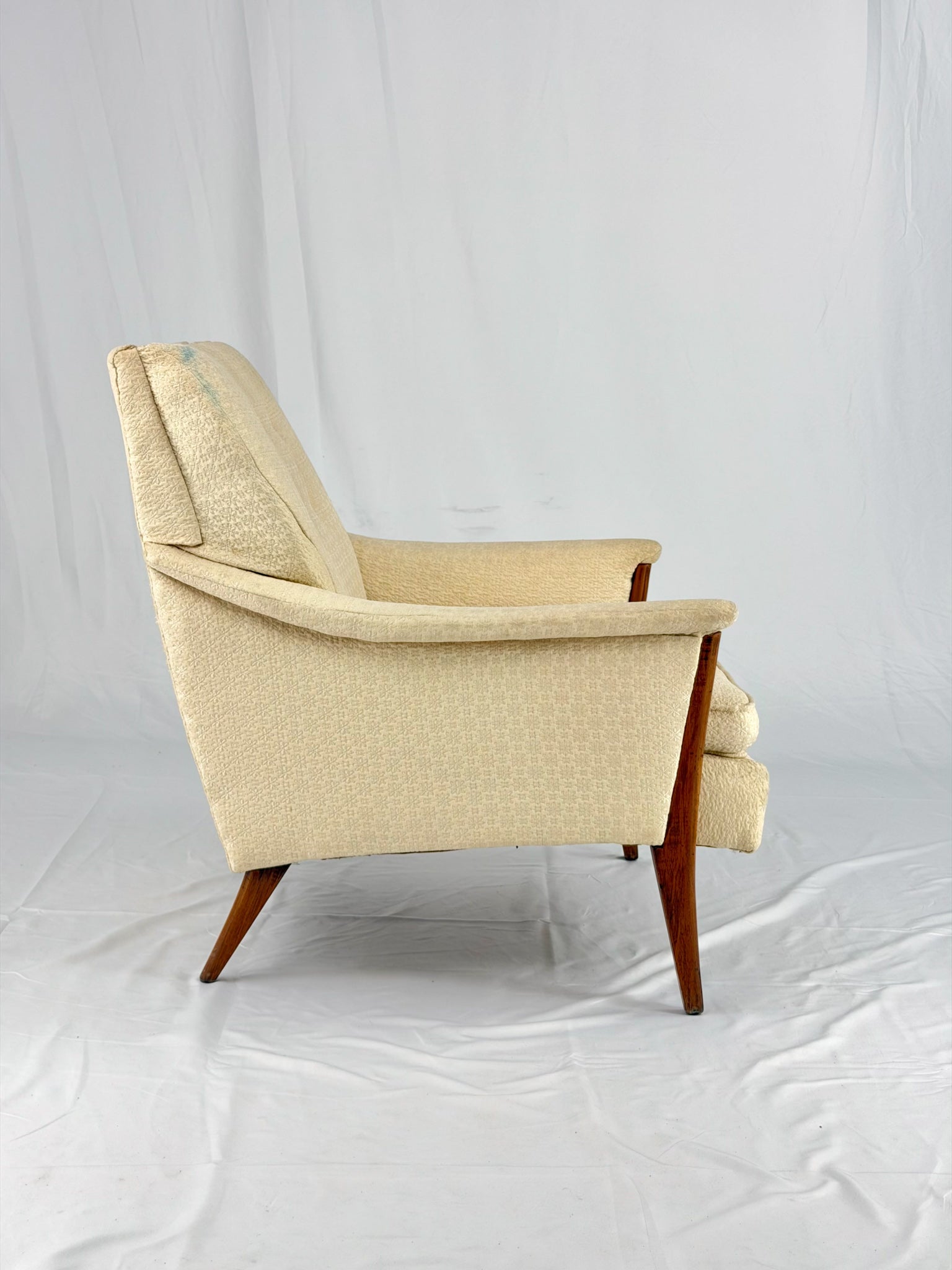 Beige armchair on a white background