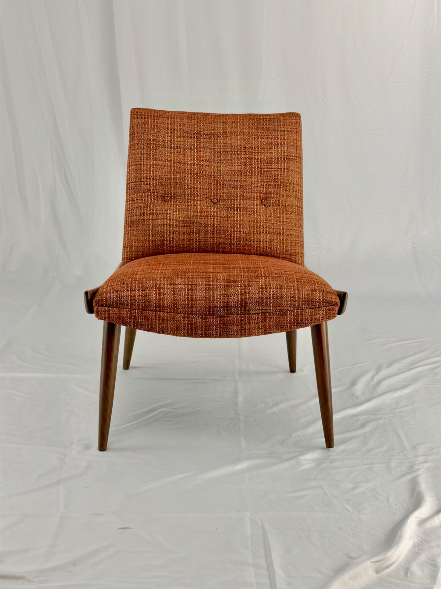 Wooden chair with orange upholstery chair on a white background