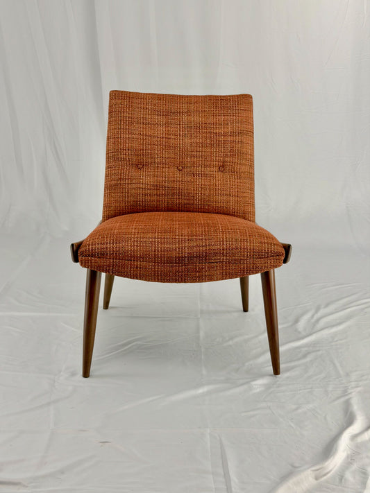 Wooden chair with orange upholstery chair on a white background