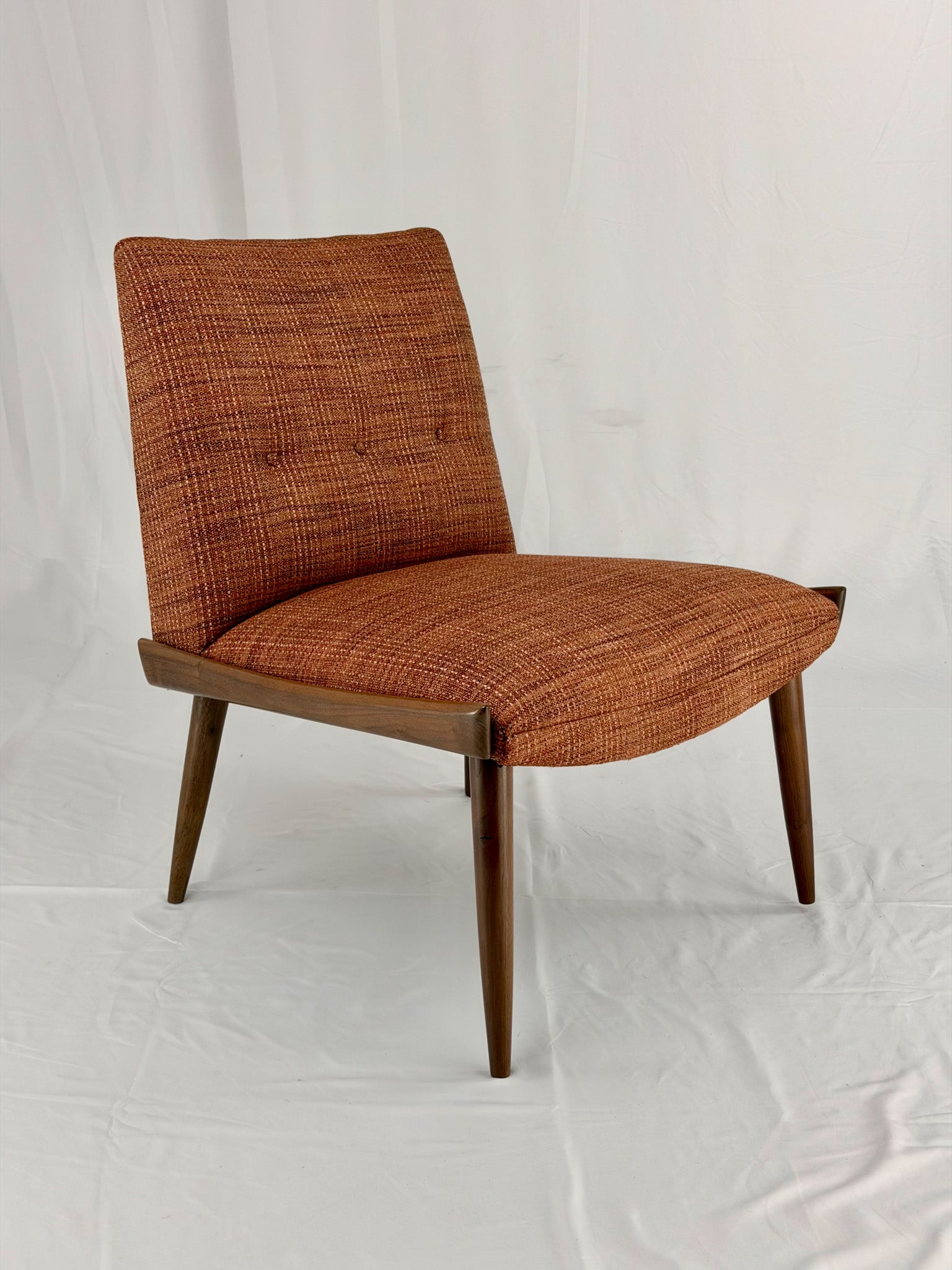 Wooden chair with orange upholstery chair on a white background