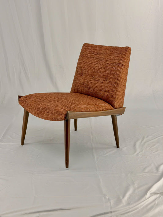 Wooden chair with orange upholstery chair on a white background