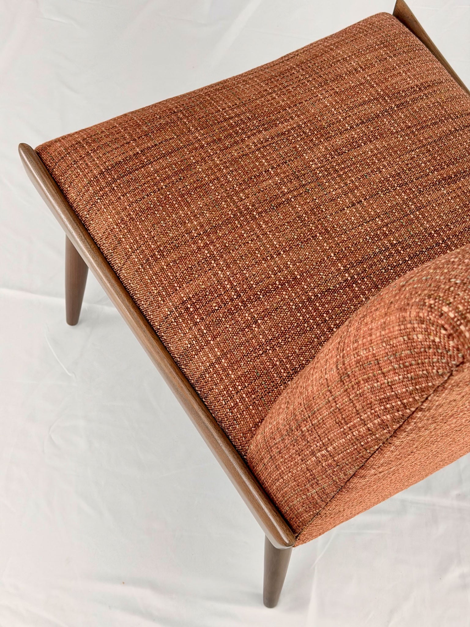 Wooden chair with orange upholstery chair on a white background