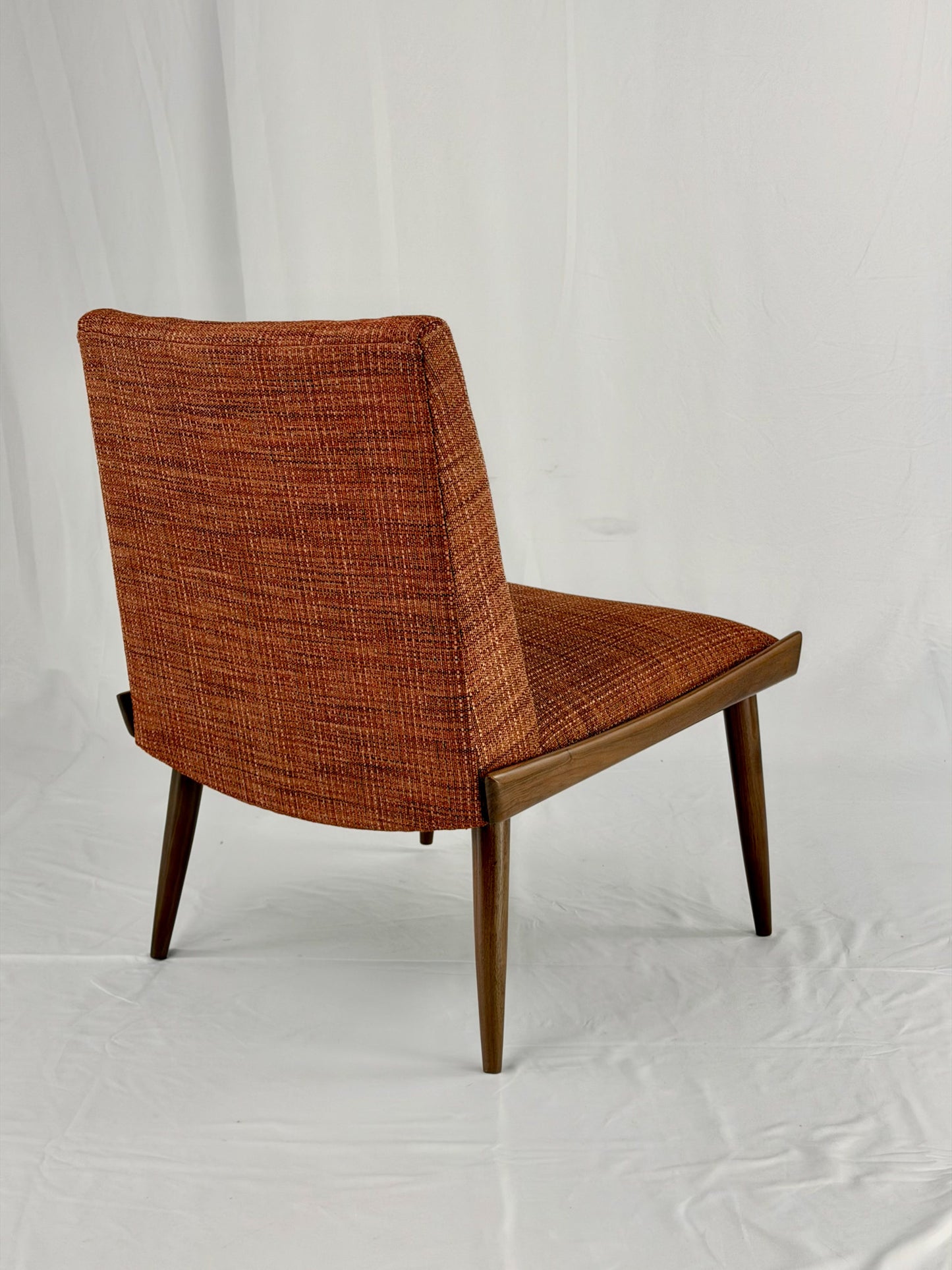 Wooden chair with orange upholstery chair on a white background
