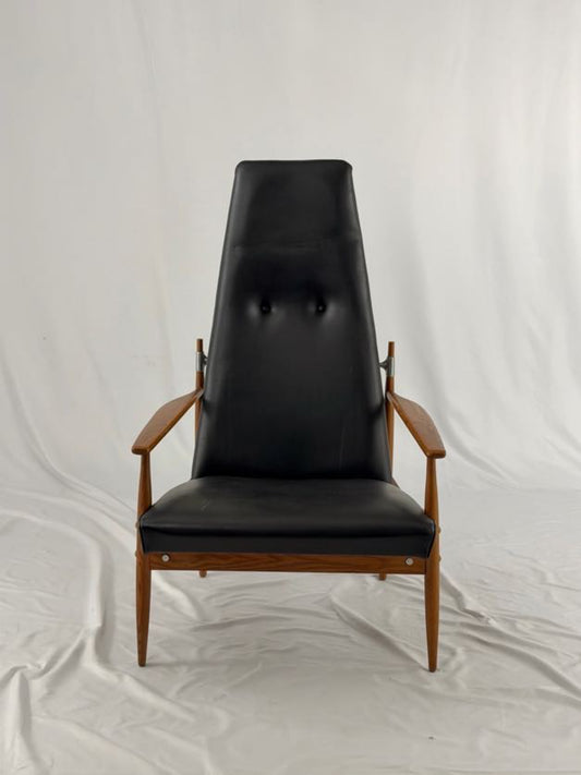 Black leather armchair with wooden frame on a white background