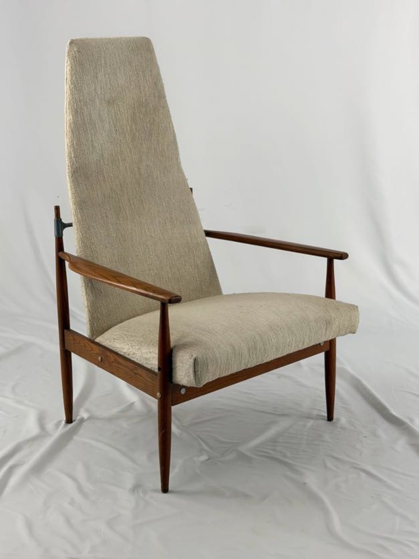 Beige armchair with wooden frame on a white background