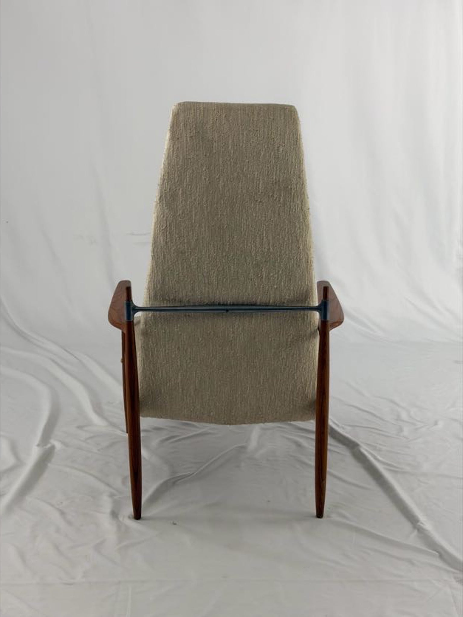 Beige armchair with wooden frame on a white background