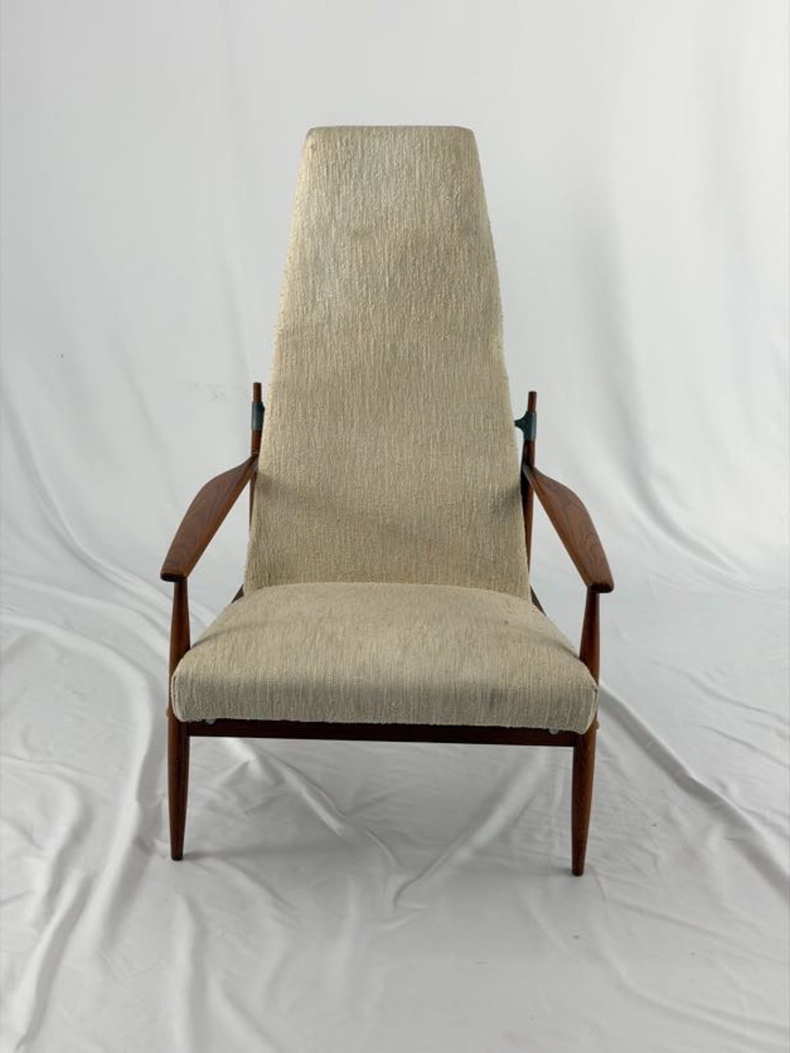 Beige armchair with wooden frame on a white background