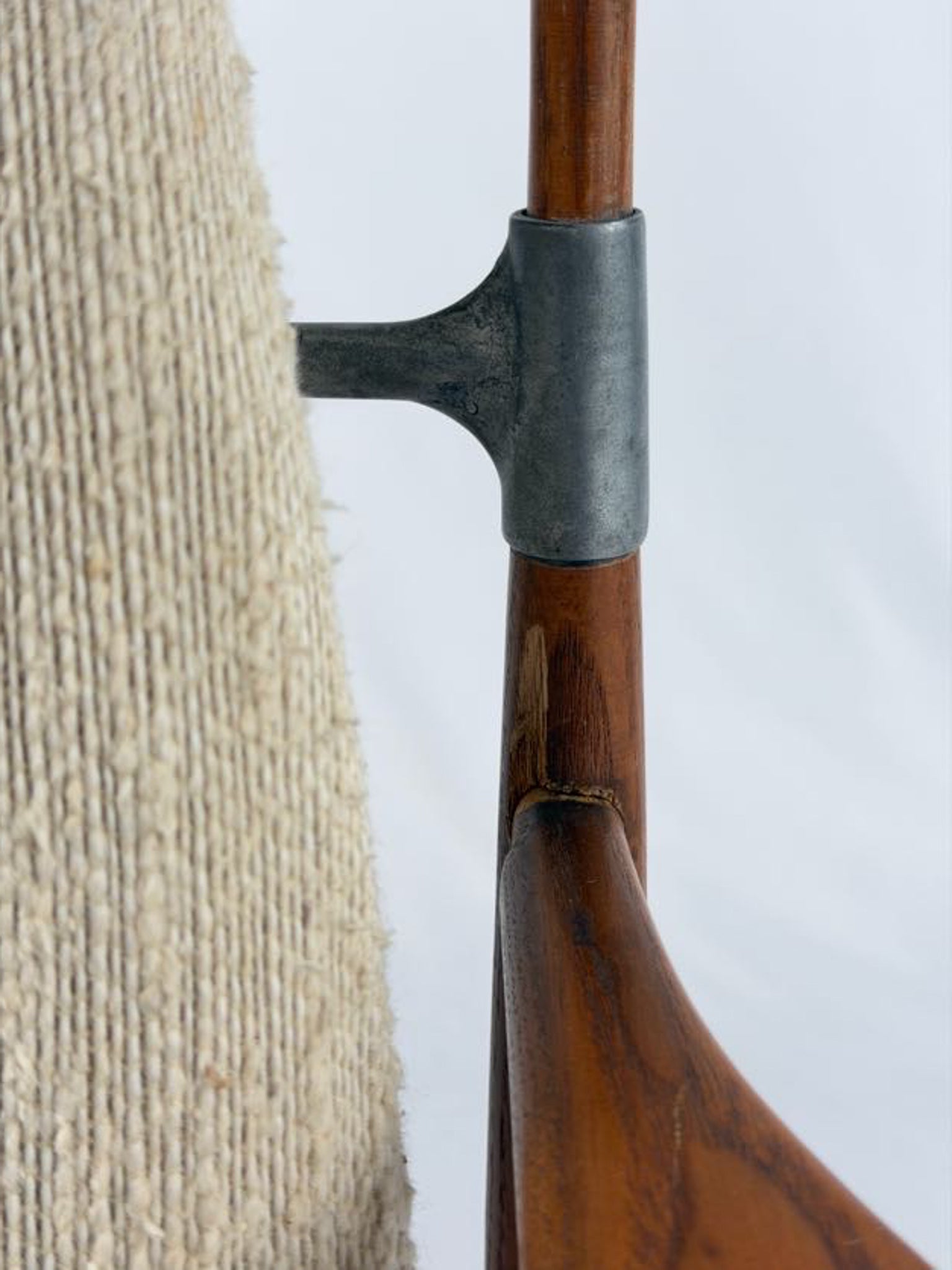 Beige armchair with wooden frame on a white background