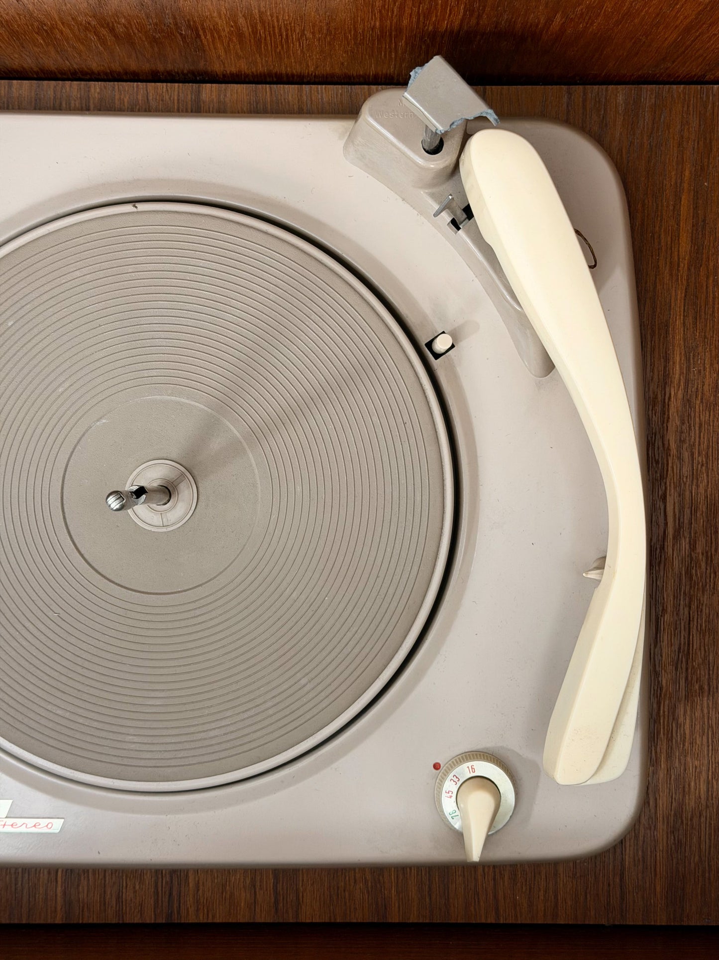 Close-up of a vintage record player on a wooden surface