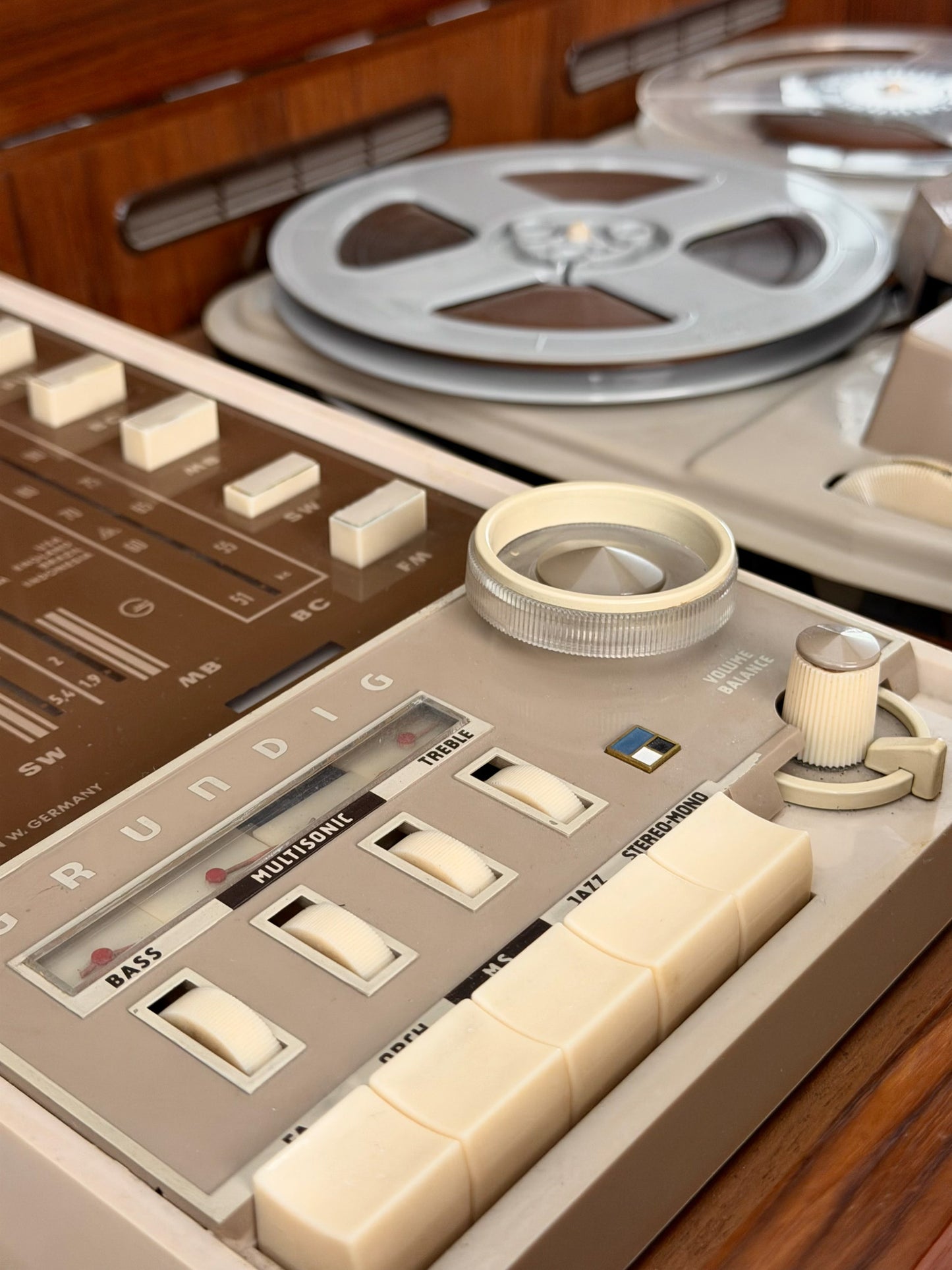 Close-up of a vintage reel-to-reel tape recorder with control panel details.