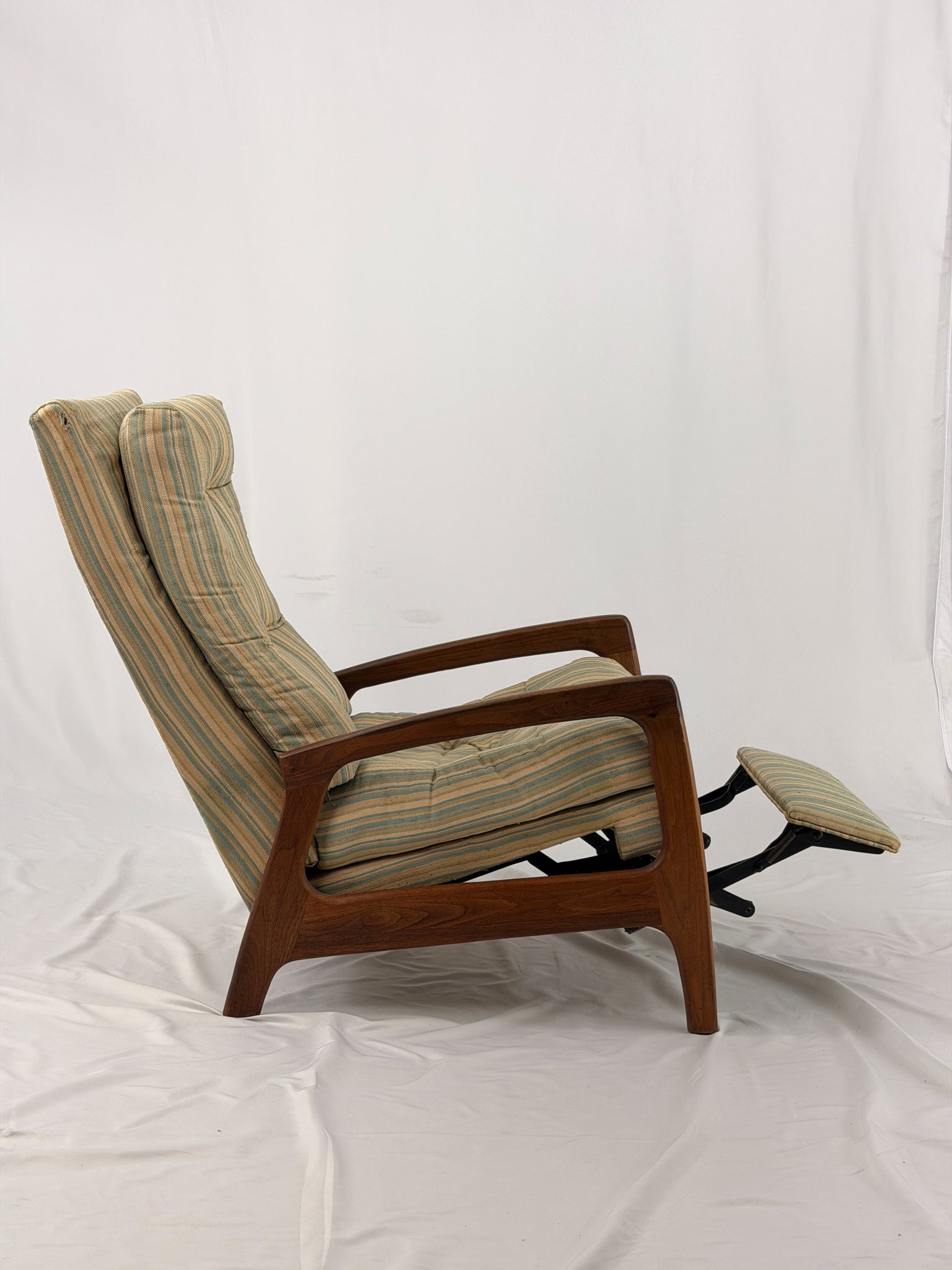Vintage Adrian Pearsall recliner with striped cushion on a white background