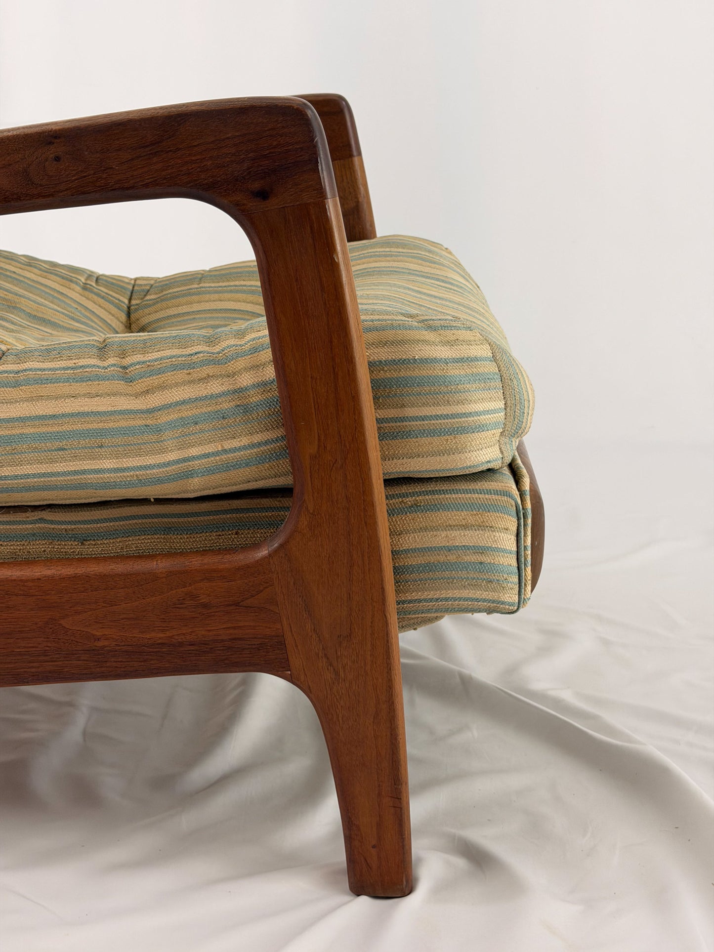 Vintage Adrian Pearsall recliner with striped cushion on a white background