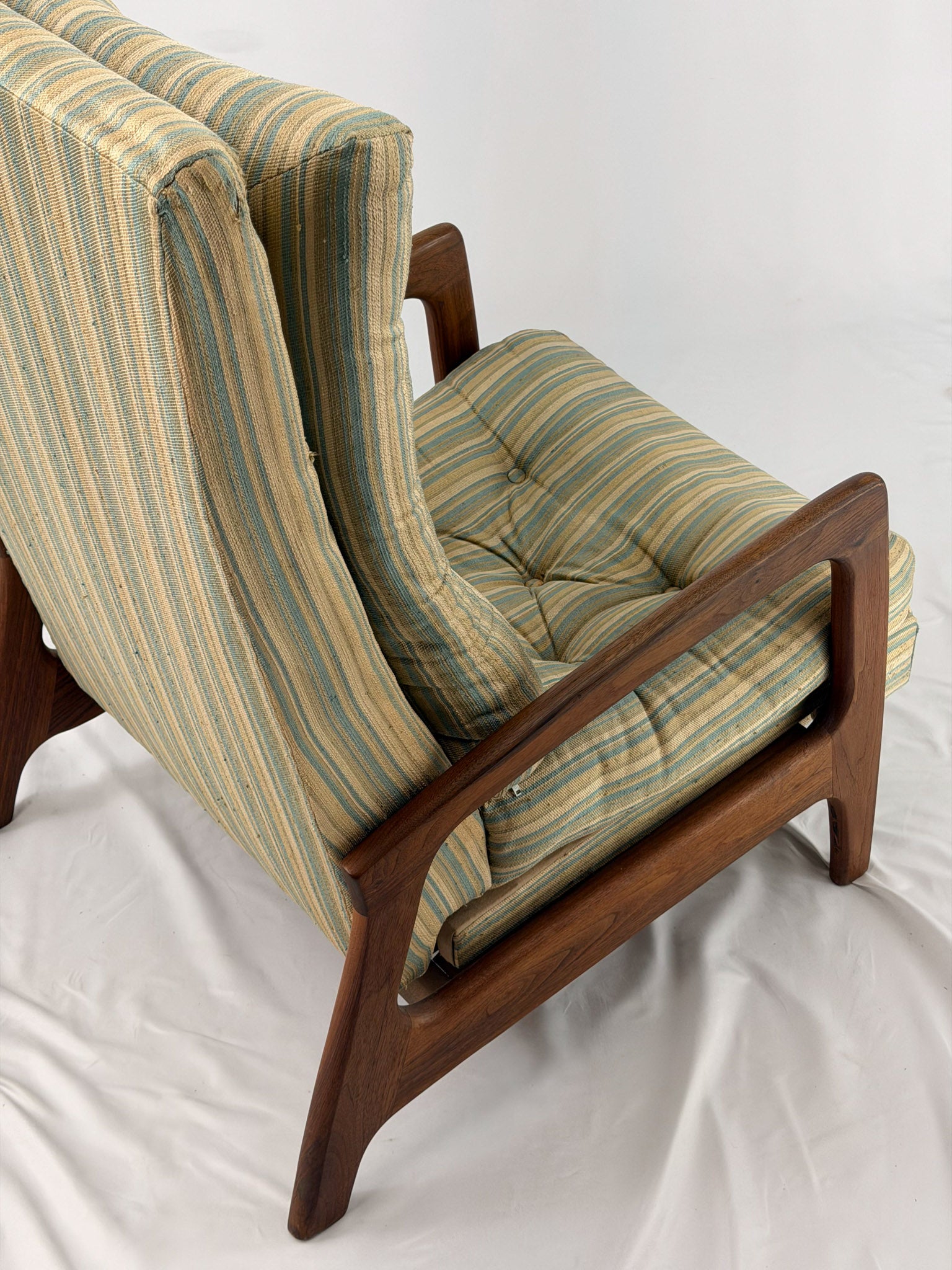 Vintage Adrian Pearsall recliner with striped cushion on a white background