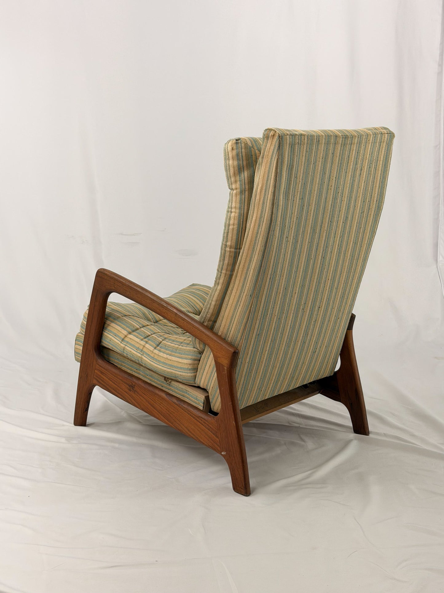 Vintage Adrian Pearsall recliner with striped cushion on a white background