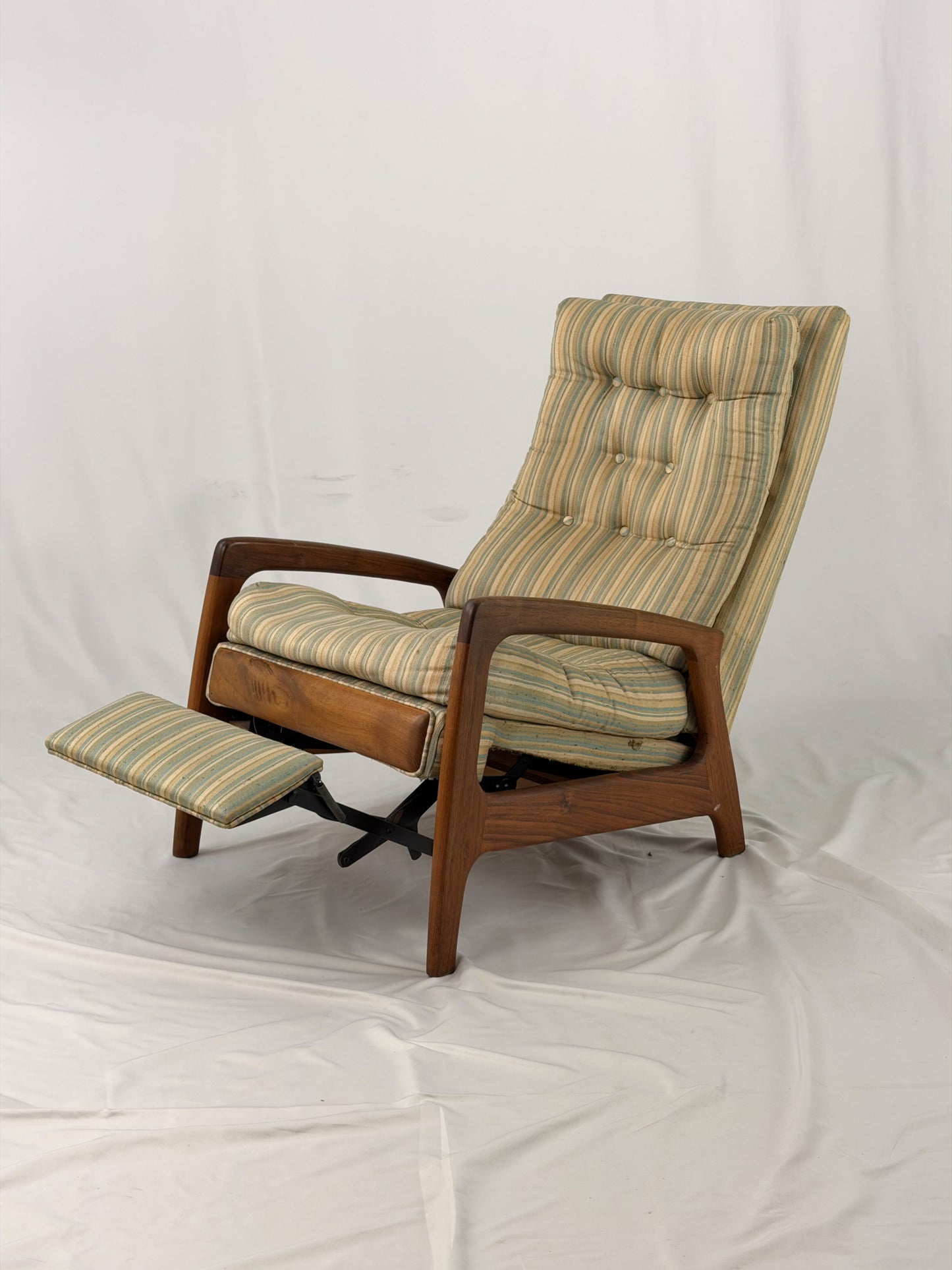 Vintage Adrian Pearsall recliner with striped cushion on a white background