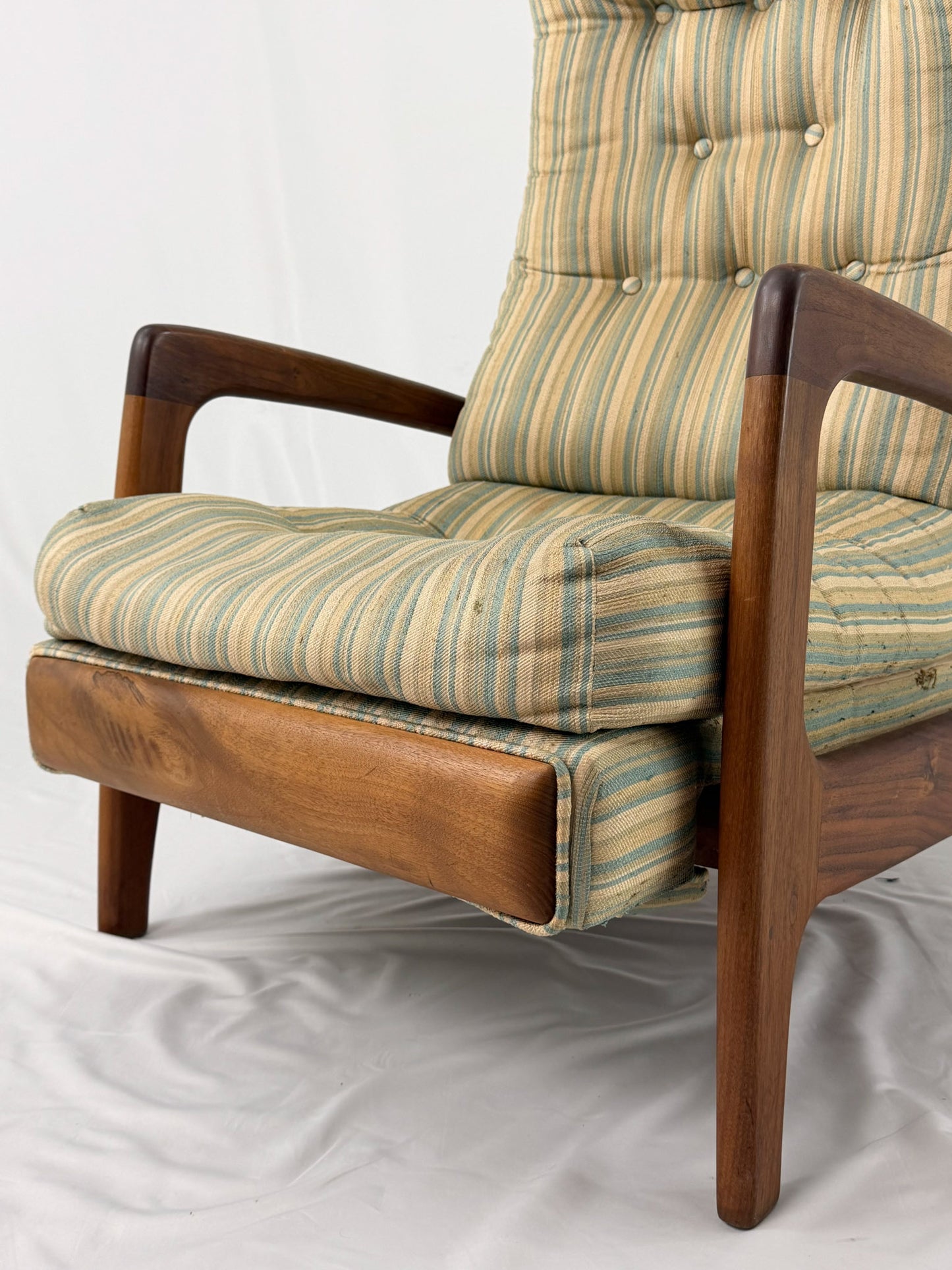 Vintage Adrian Pearsall recliner with striped cushion on a white background