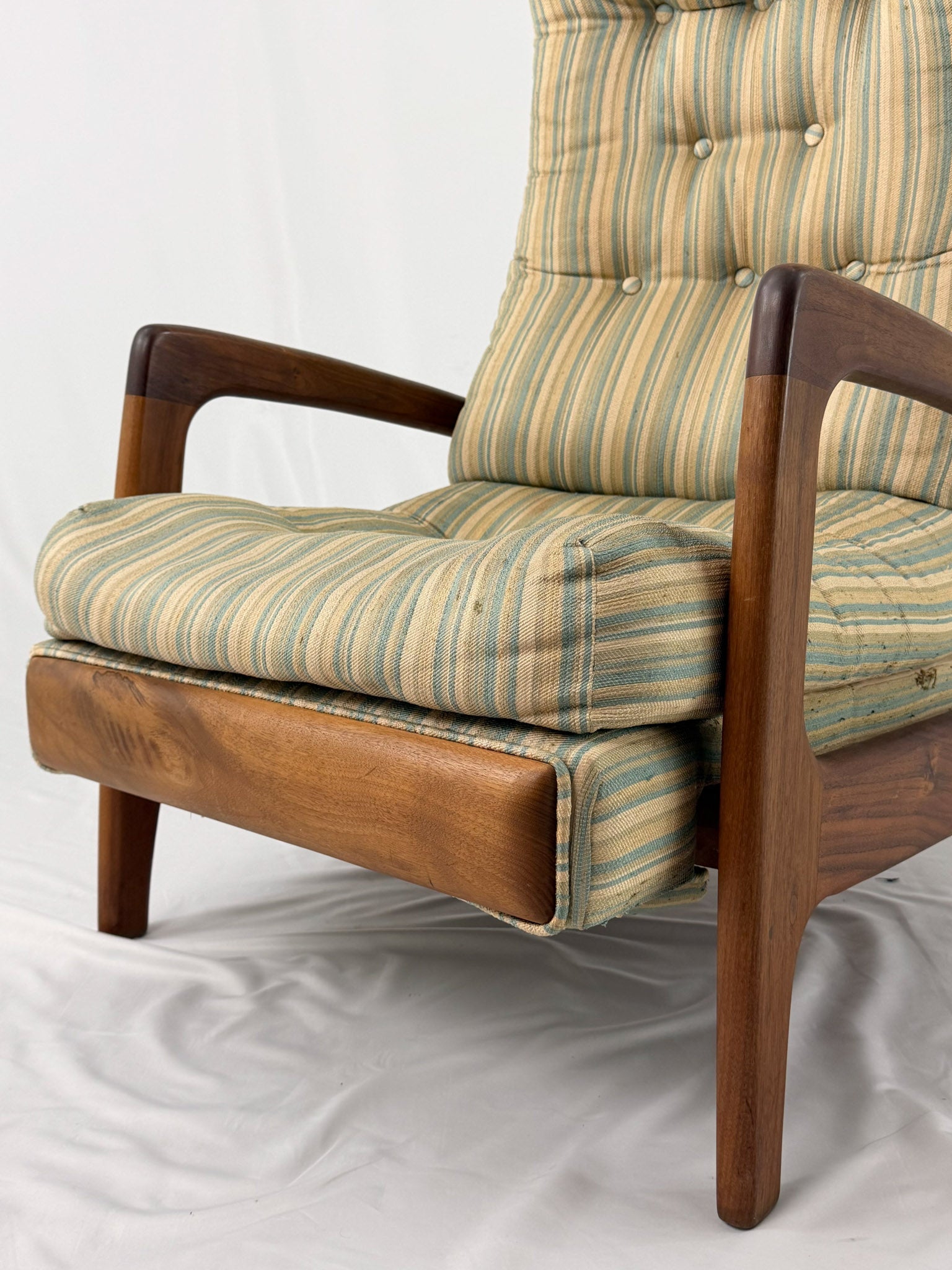 Vintage Adrian Pearsall recliner with striped cushion on a white background