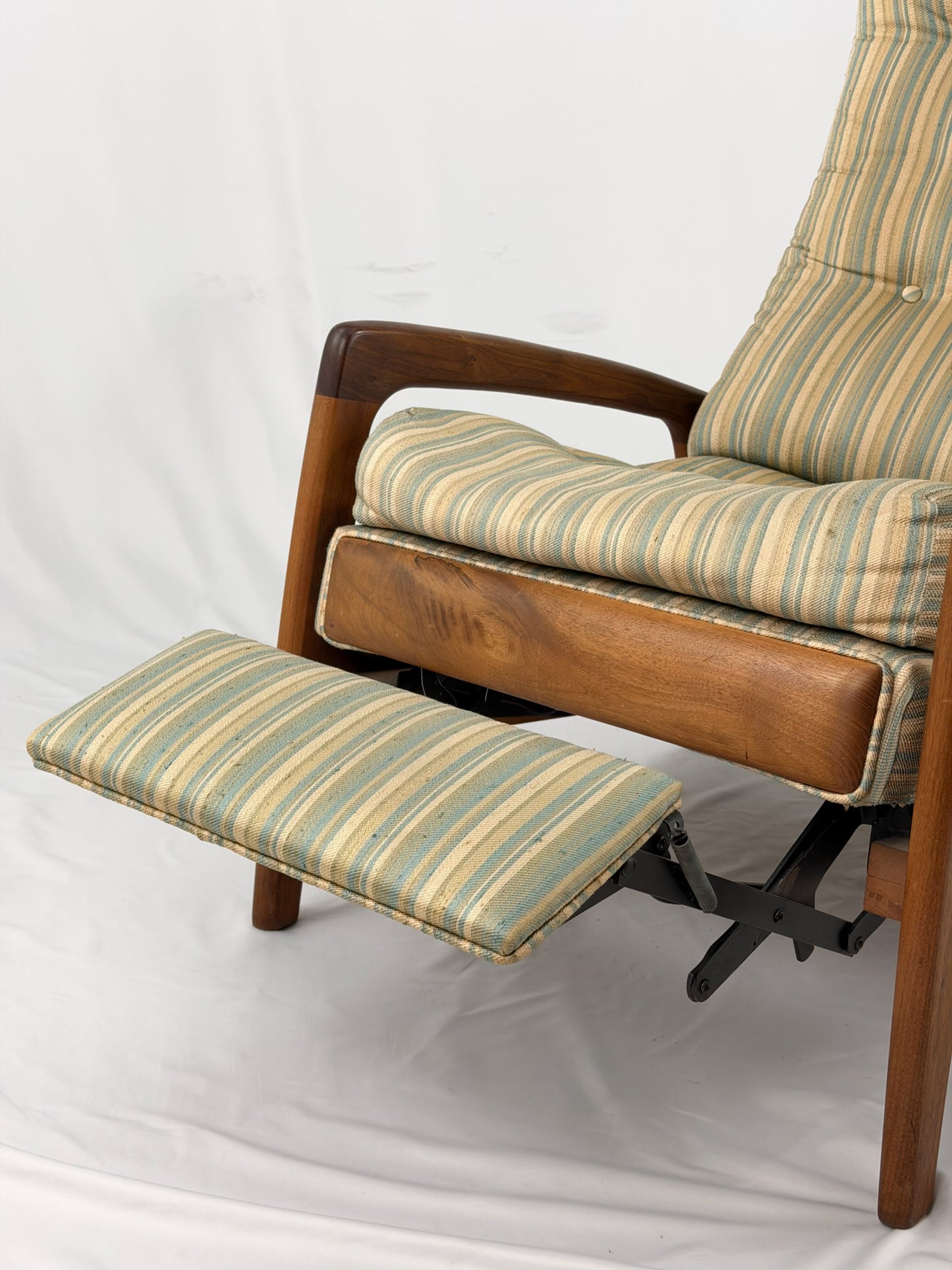 Vintage Adrian Pearsall recliner with striped cushion on a white background