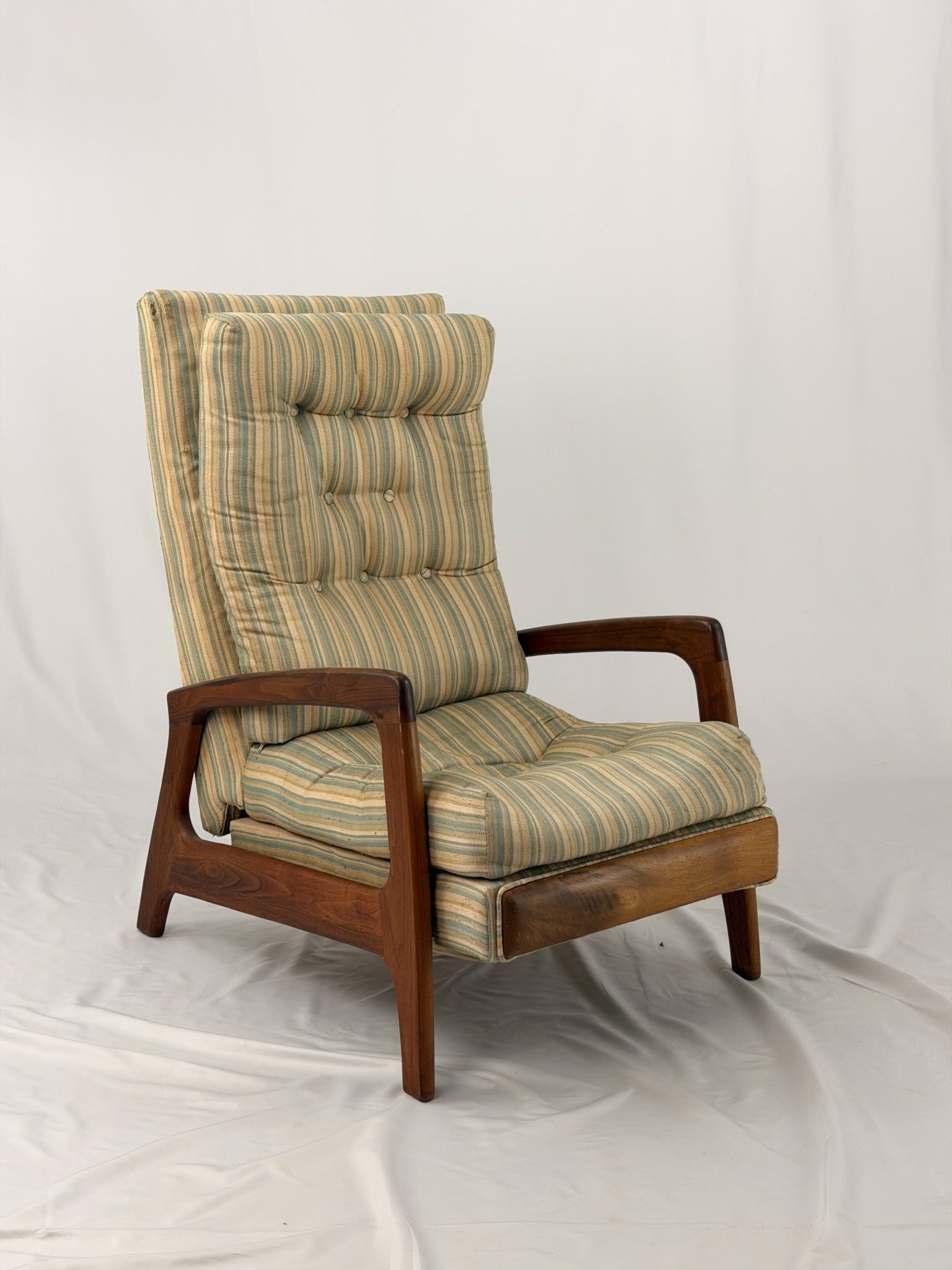 Vintage Adrian Pearsall recliner with striped cushion on a white background