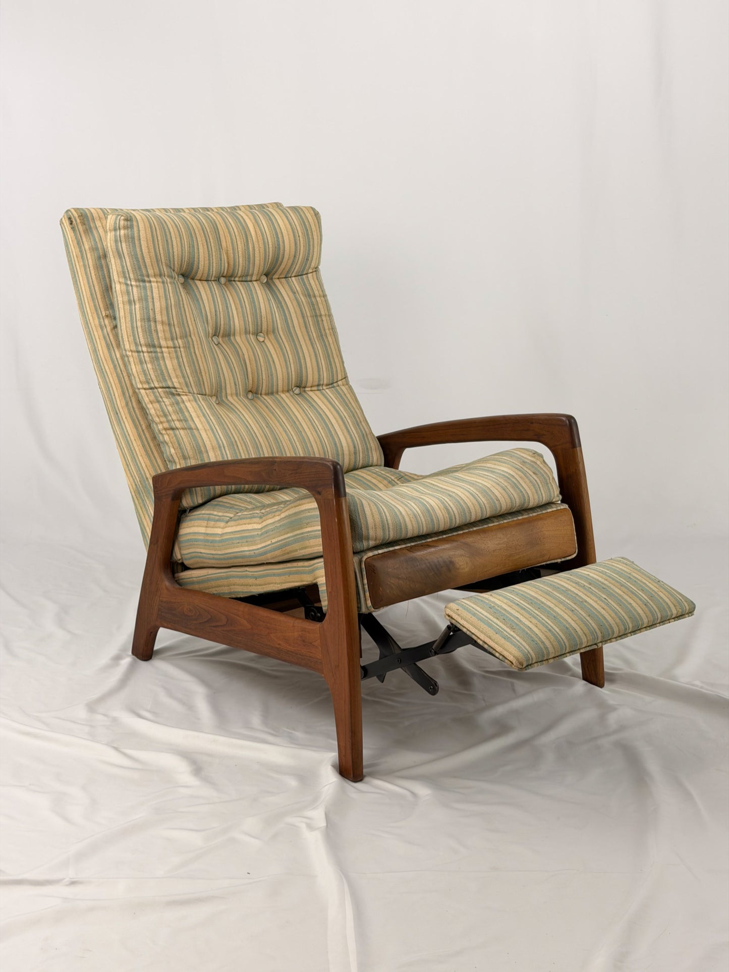 Vintage Adrian Pearsall recliner with striped cushion on a white background
