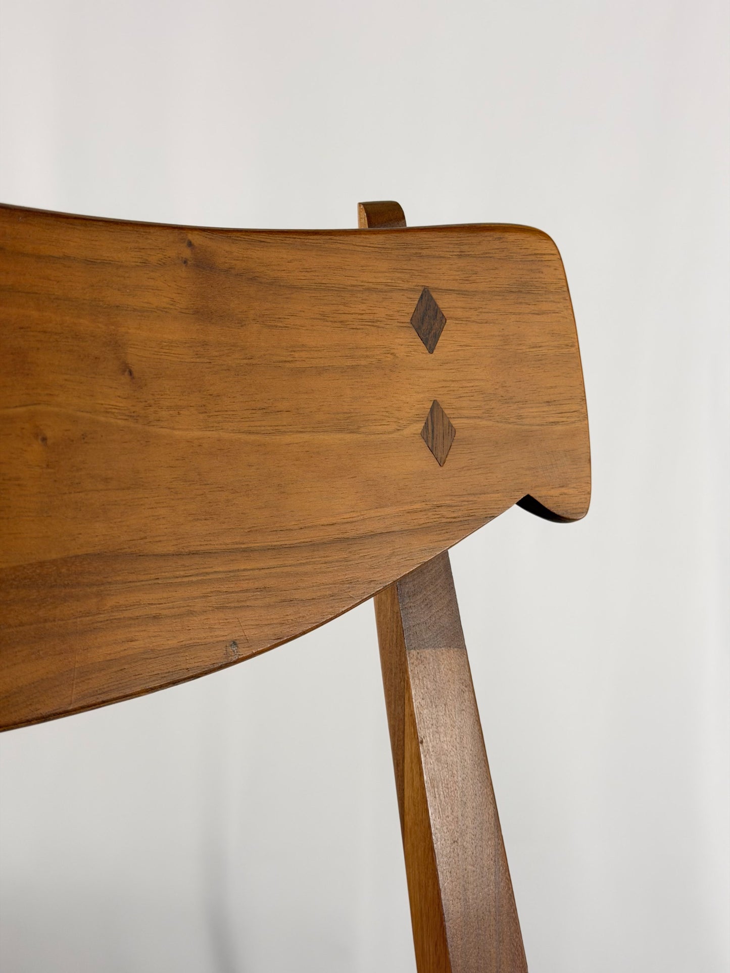 Wooden chair with a plain white background