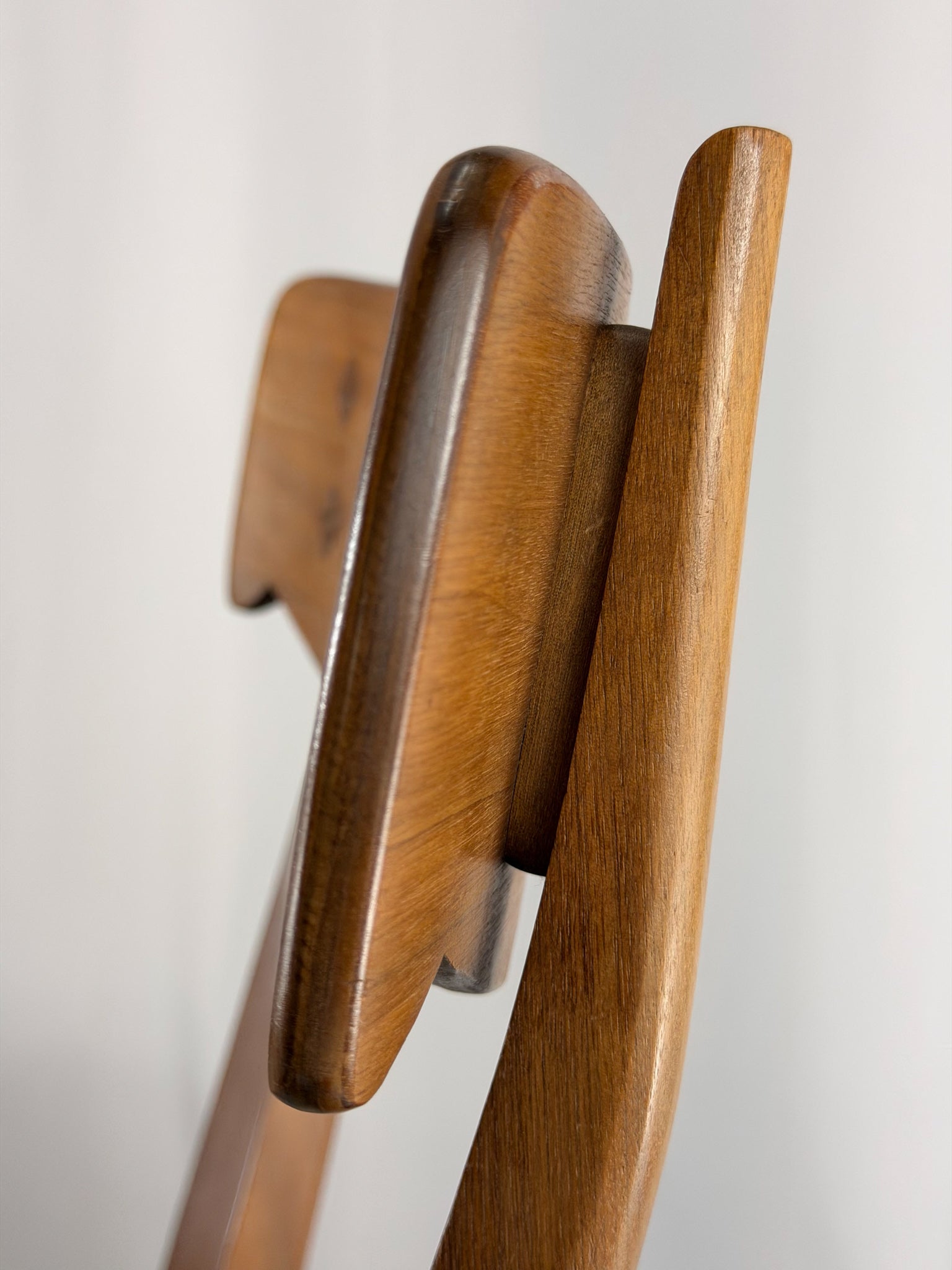 Wooden coat hanger on a white background